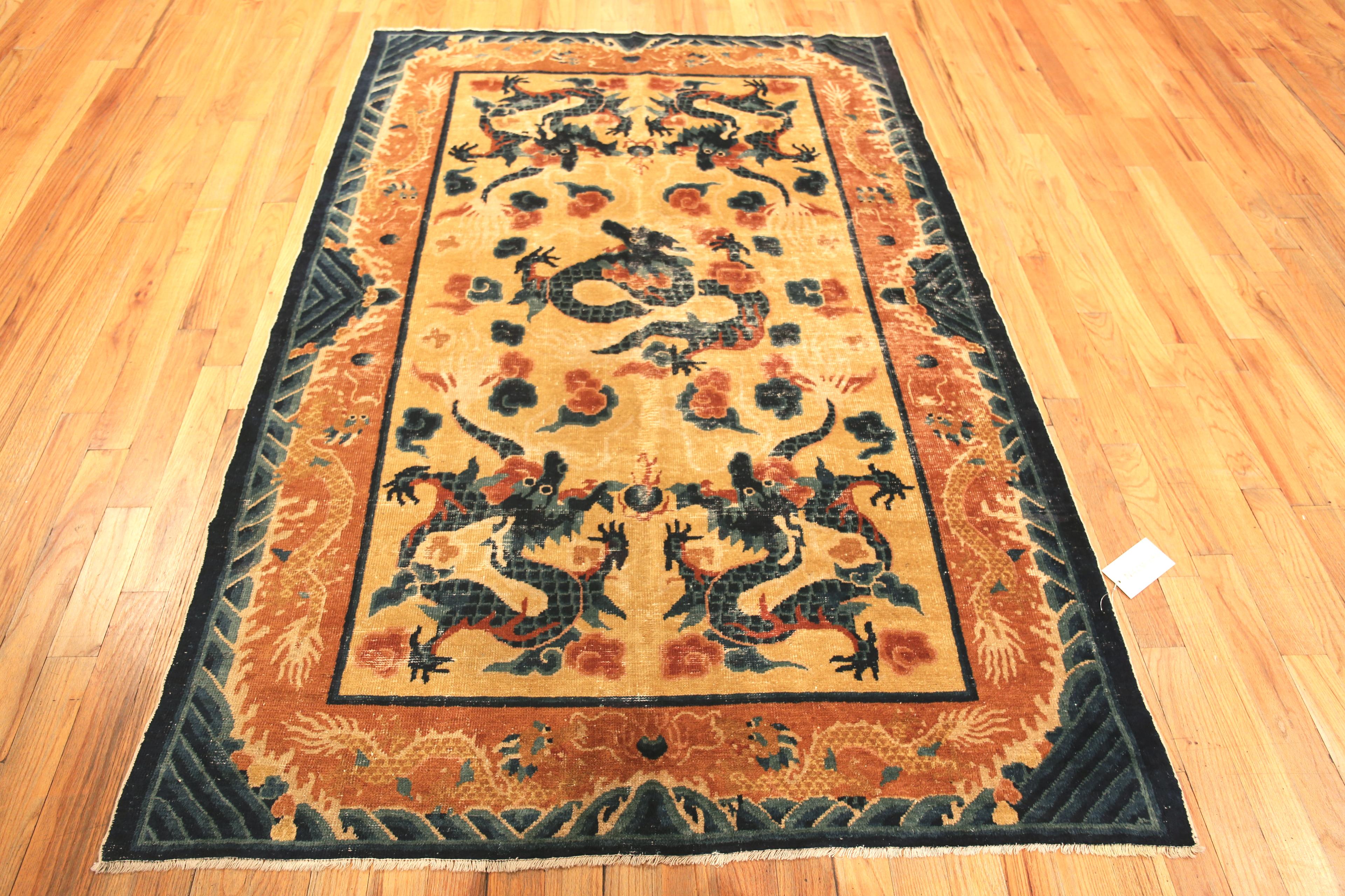 Artistic Antique Chinese Five Claw Dragon Design Shabby Chic Rug, Country of Origin: China, Circa date: 1880. Size: 5 ft 3 in x 7 ft 8 in (1.6 m x 2.34 m)
 