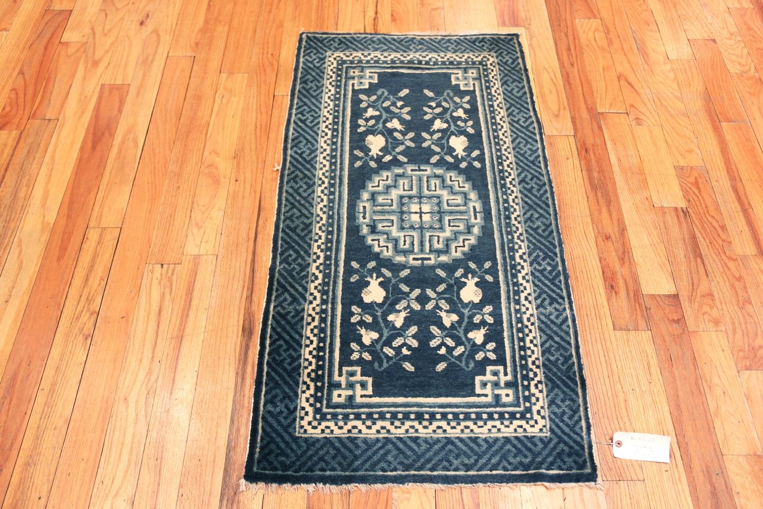 Charming And Artistic Blue Background With White Patterns Antique Pomegranate Design Chinese Rug, Country of Origin: China, Circa Date: 1900 – This is a small scatter size rug that’s optimal for people who want to decorate their home with a