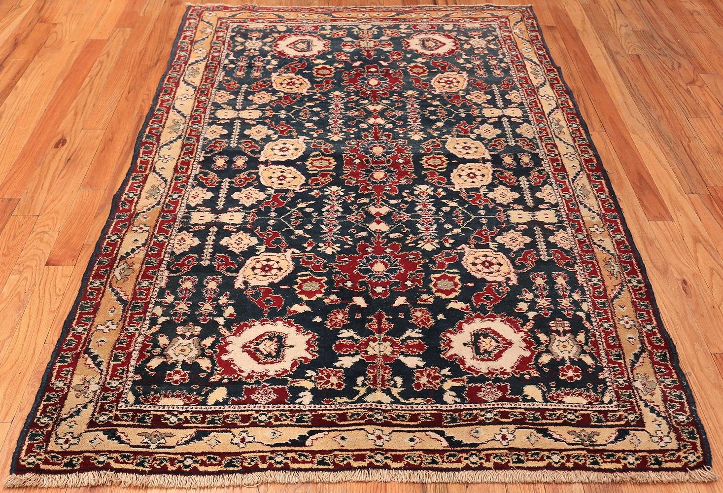 A Beautiful Blue Color Background Small Size Antique Agra Rug, Origin: India, Circa: 1920 – This gorgeous Indian Agra rug from the 1920s is a bright and colorful addition to traditional or contemporary décor styles. The brilliant reds and blues are