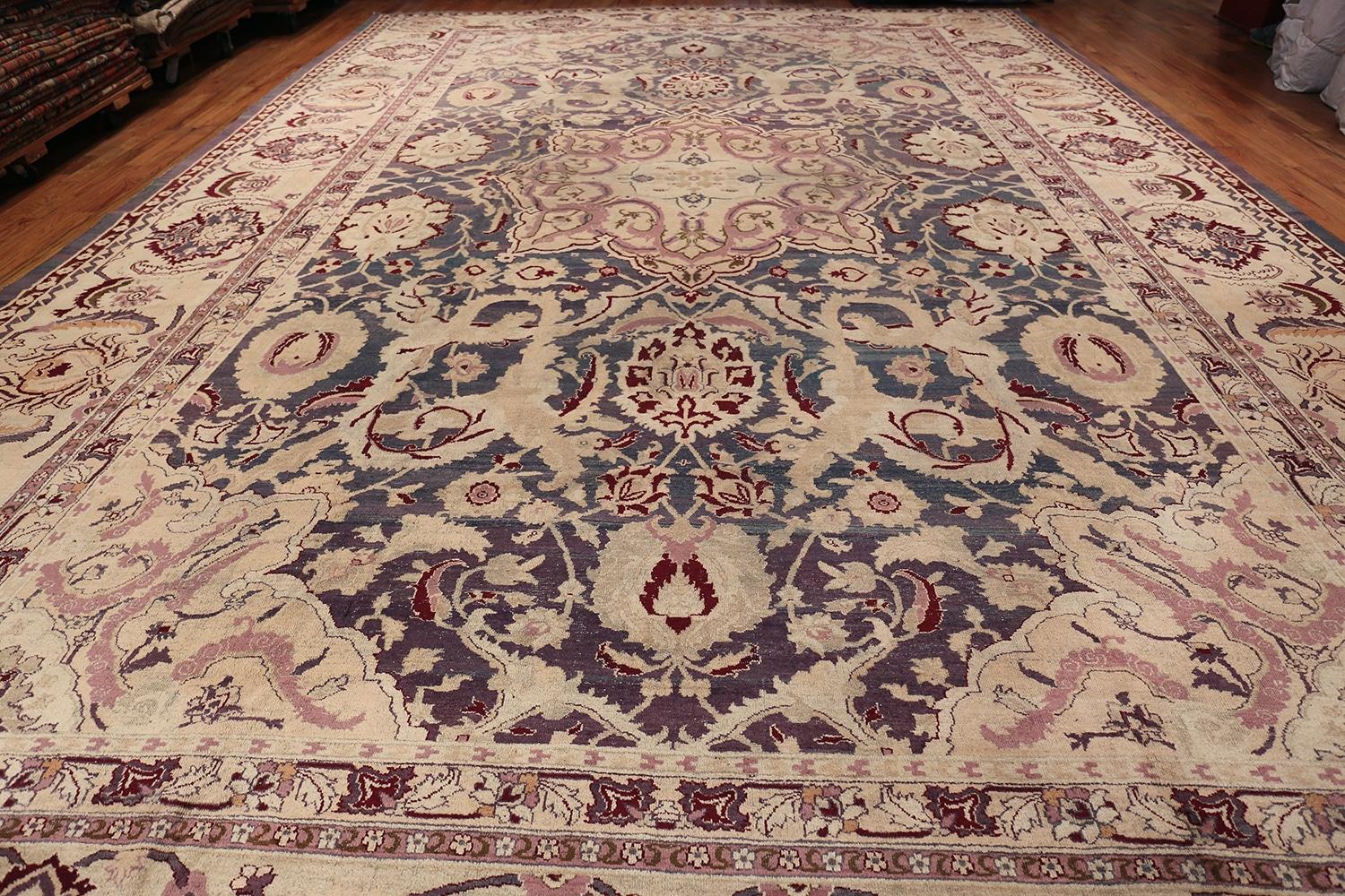 Magnificent light purple color background large oversize antique Indian Agra rug, country of origin: India, circa late 19th century, size: 14 ft. x 20 ft. 10 in (4.27 m x 6.35 m)

This antique Indian carpet created in Agra features a splendid