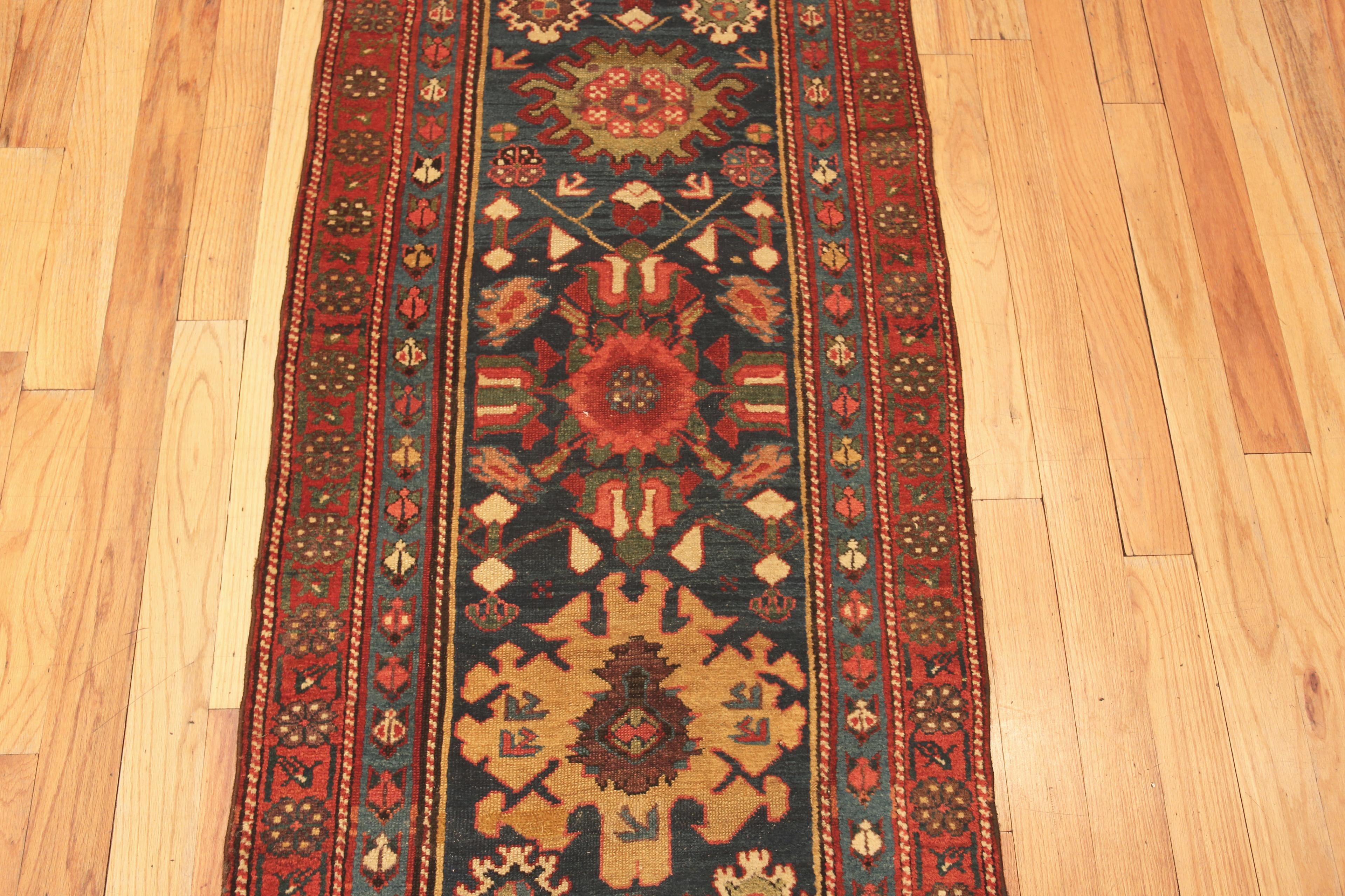 19th Century Antique Tribal North West Persian Hallway Runner Rug, Country of Origin: Persia, Circa date: 1880. Size: 2 ft 7 in x 18 ft (0.79 m x 5.49 m)
   