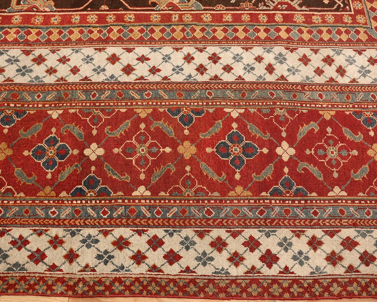 Beautiful large scale design brown antique oriental oversized Indian Agra rug, country of origin: india,date circa late 19th century. Size: 15 ft 2 in x 23 ft 8 in (4.62 m x 7.21 m)

A combination of reds and rich chocolate browns create a