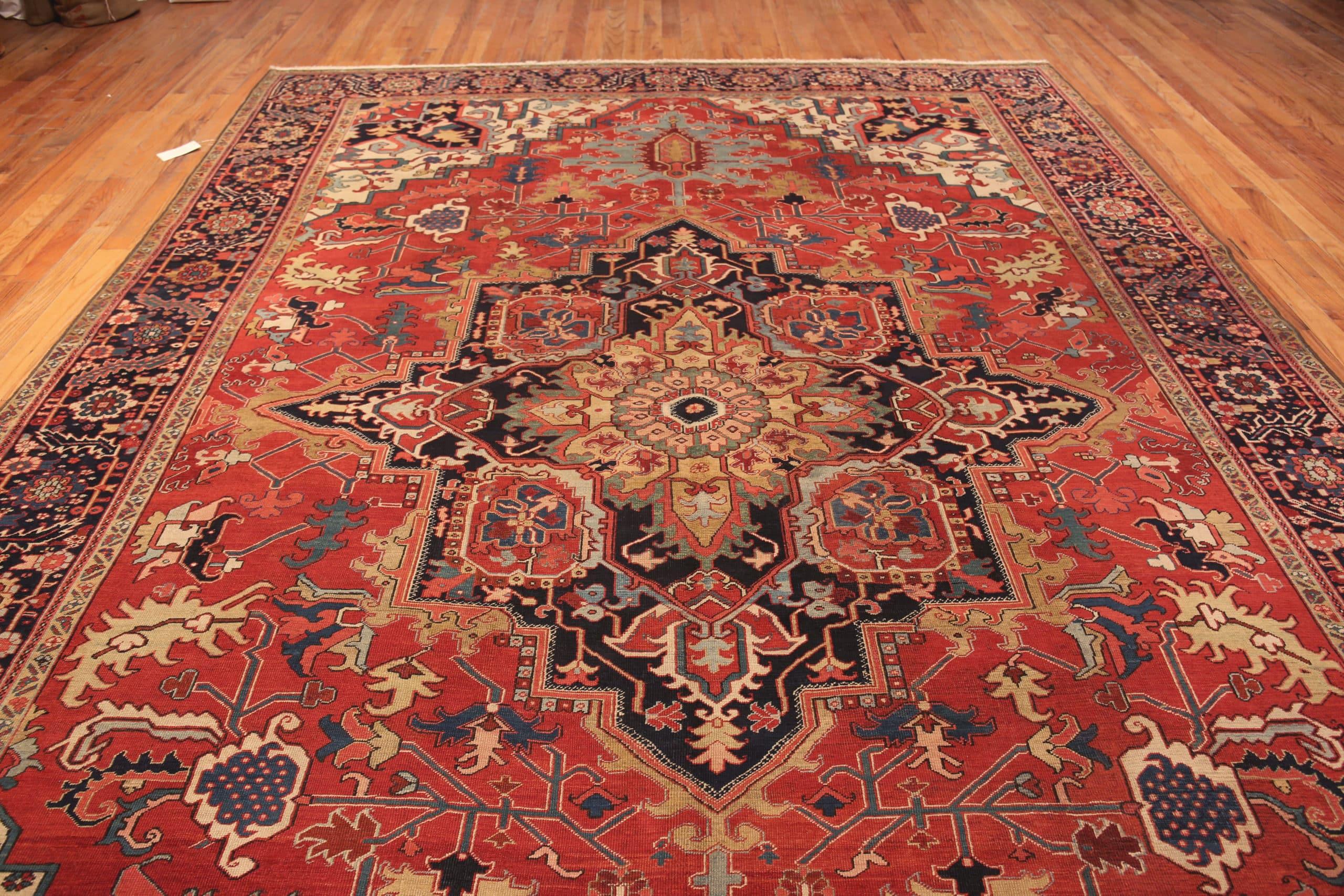 Beautiful Large Antique Jewel Tone Persian Geometric Heriz Rug, Country of Origin: Persia, Circa date: 1920. Size: 10 ft 6 in x 15 ft 4 in (3.2 m x 4.67 m)

