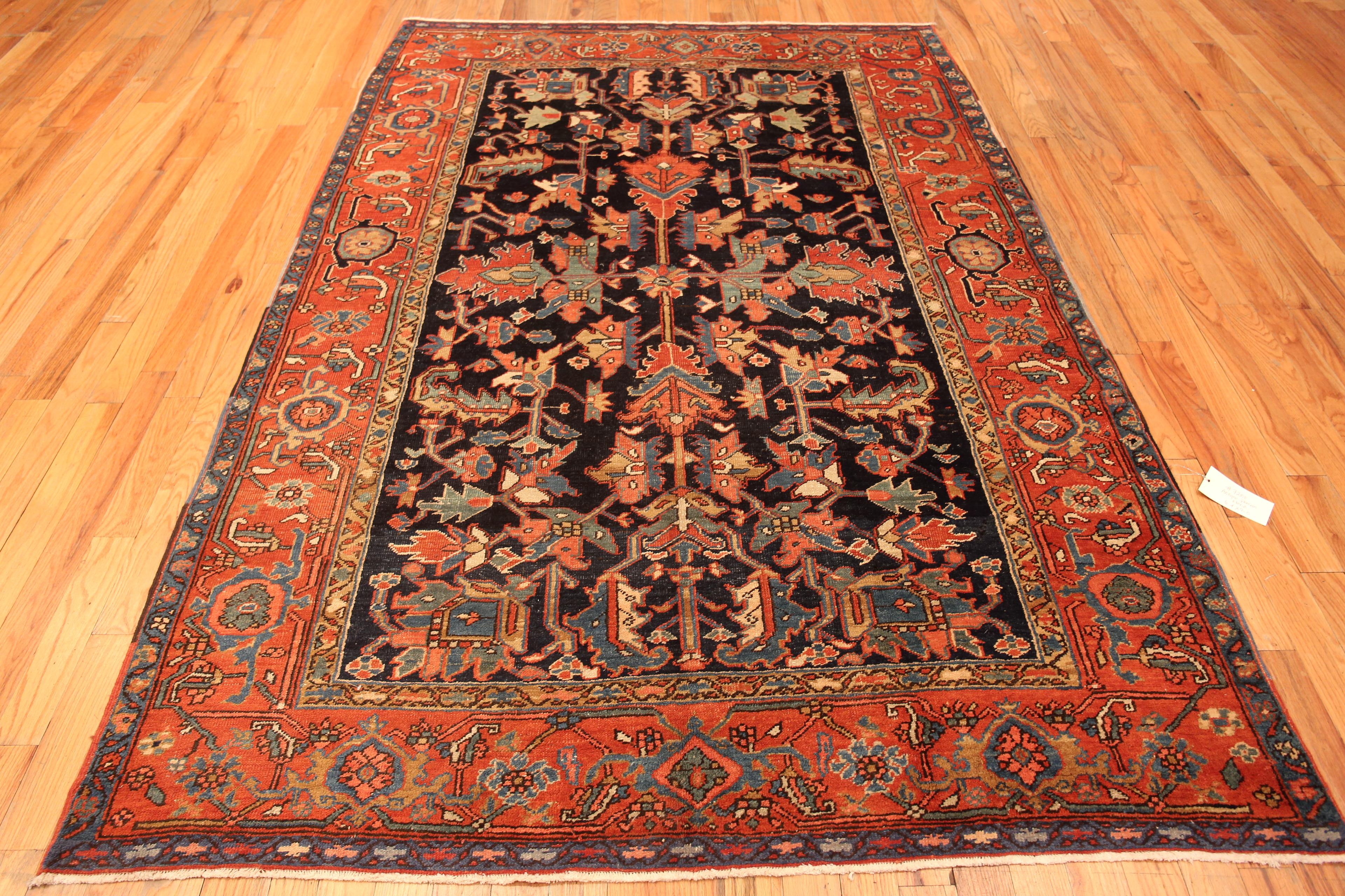 Rustic Tribal Navy Blue Background Antique Allover Persian Heriz Rug, Country of Origin: Persia, Circa date: 1920. Size: 6 ft 4 in x 9 ft (1.93 m x 2.74 m)

