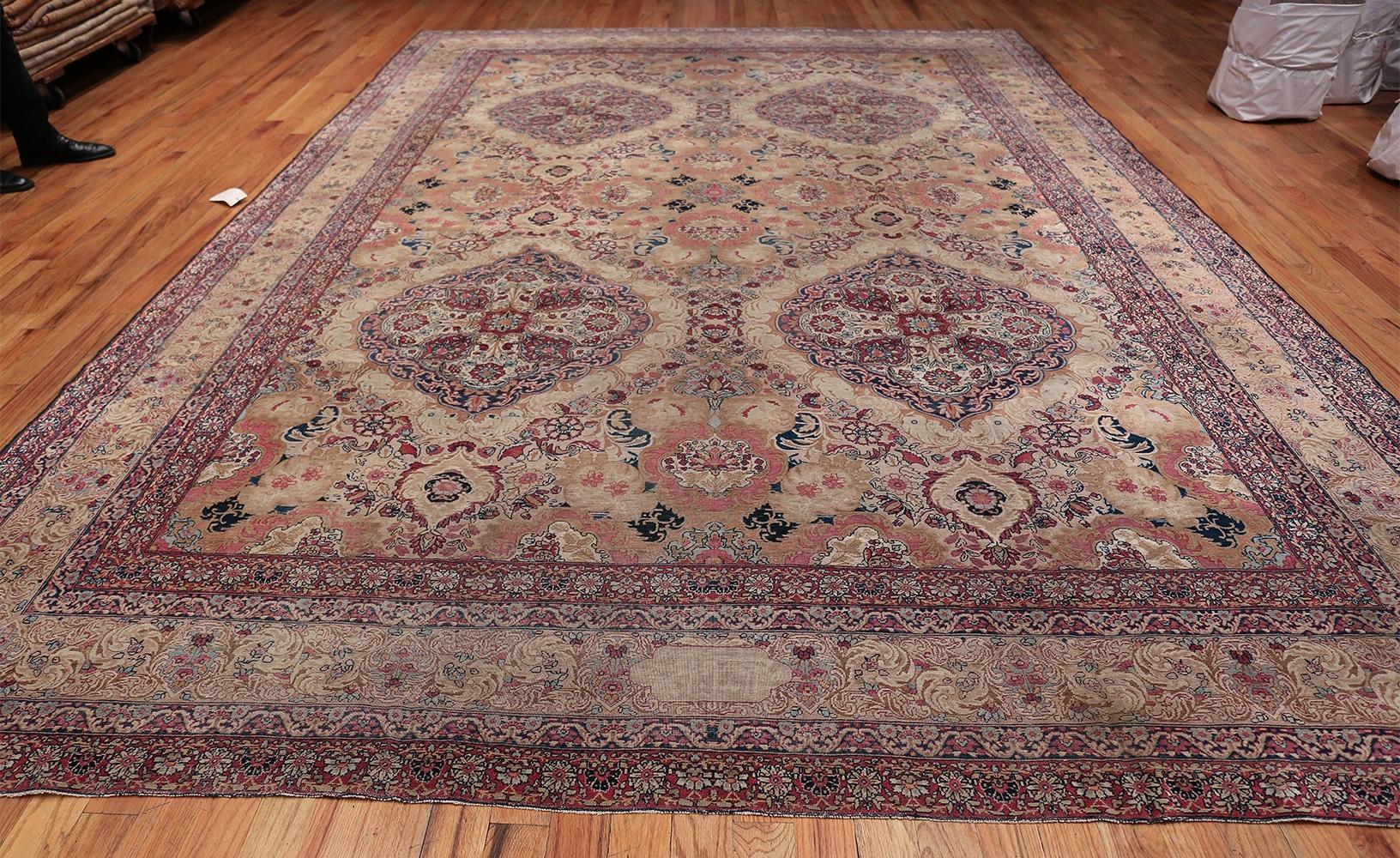 Antique Persian Kerman Lavar rug, country of origin: Persia, date circa late 19th century. Size: 10 ft x 14 ft 5 in (3.05 m x 4.39 m)

Kerman has a history of weaving fine rugs that goes back nearly 400 years. Its artisans were tasked with creating