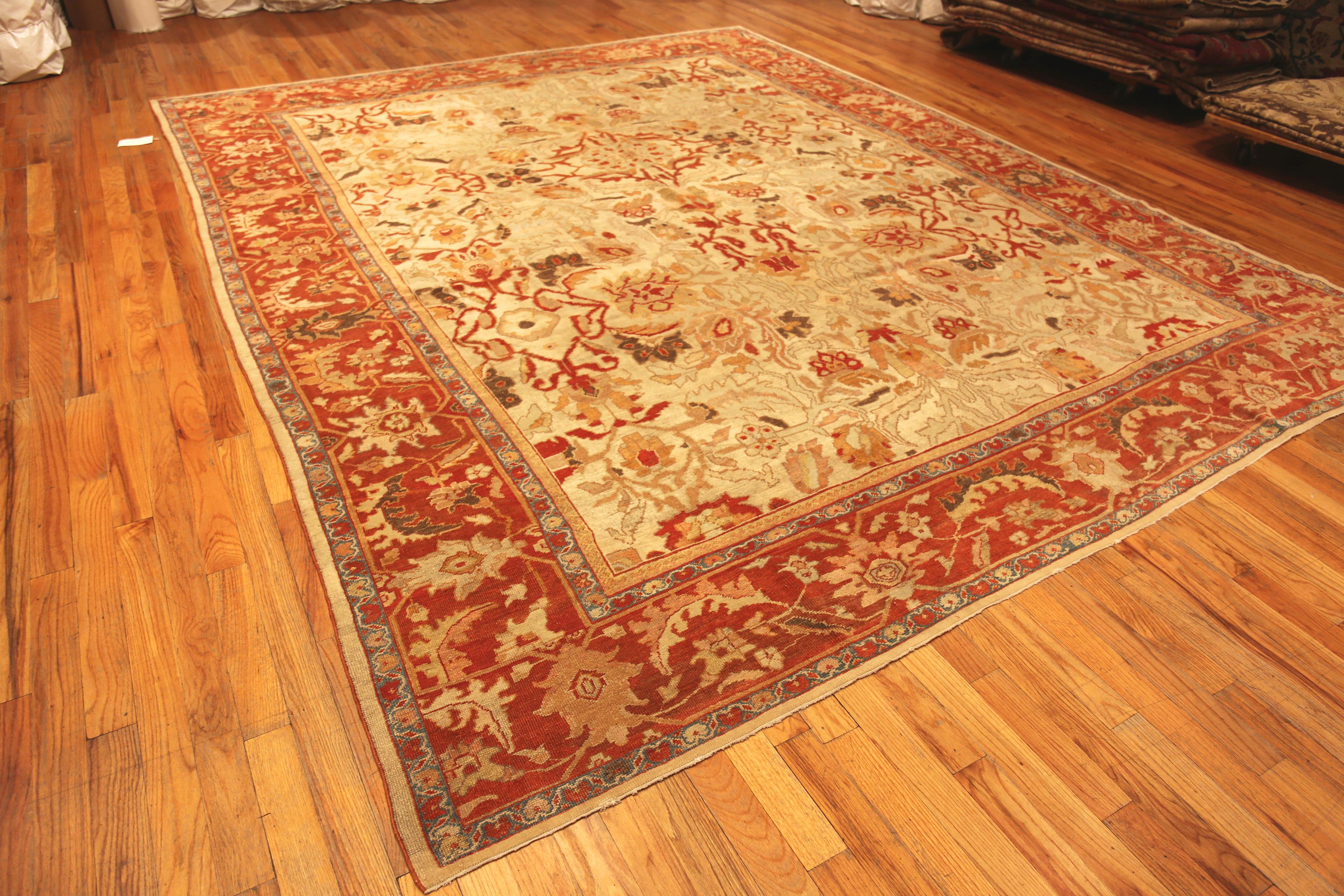 Rustic Ivory Antique Decorative Persian Sultanabad Rug, Country of Origin: Persia, Circa Date: 1880. Size: 11 ft 3 in x 13 ft 7 in (3.43 m x 4.14 m)
