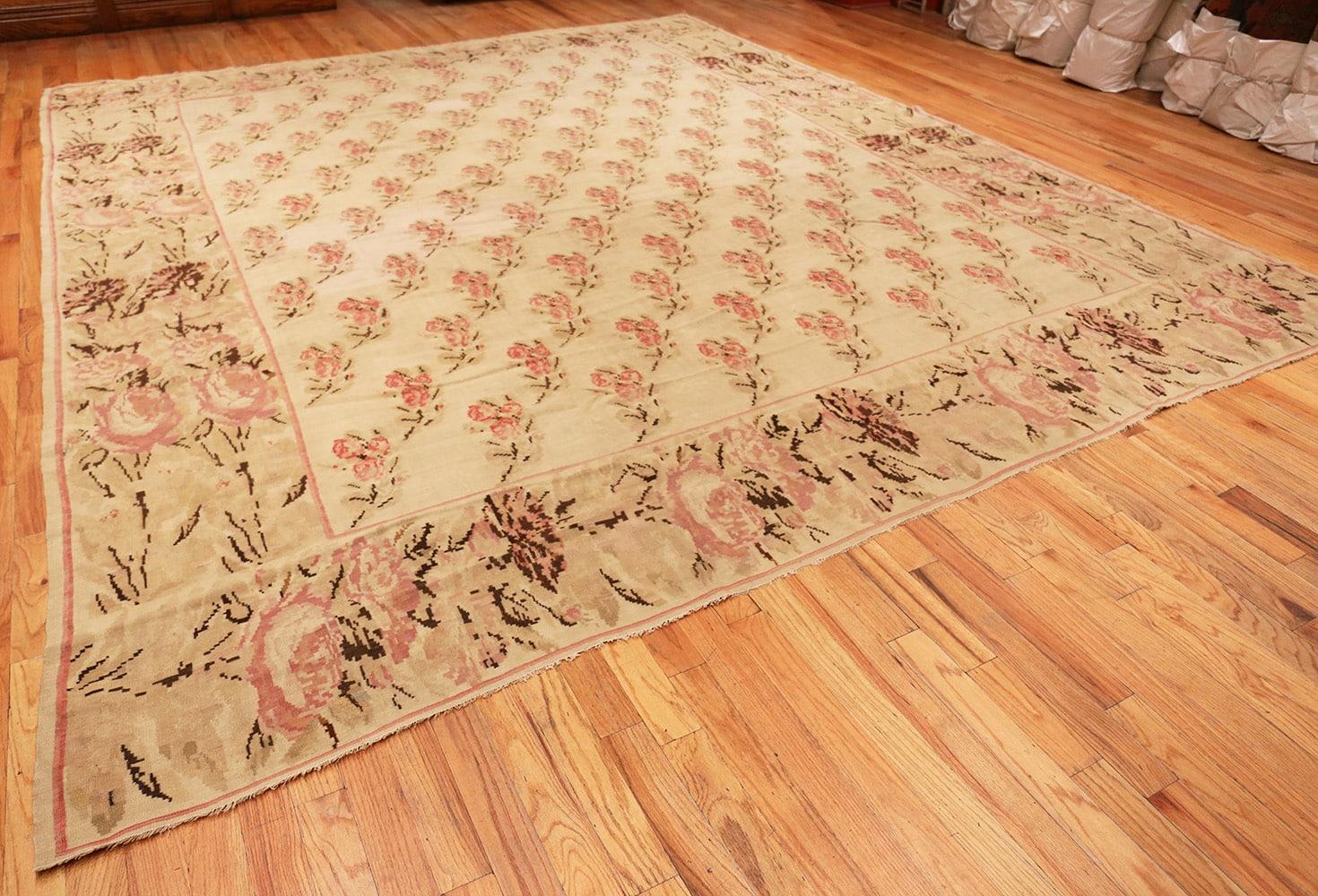 Beautiful antique Romanian Bessarabian Kilim rug, country of origin: Romania, date circa late 19th century. Size: 12 ft 9 in x 14 ft 3 in (3.89 m x 4.34 m)

Inspired by the motifs and coloration of Classic French Aubusson tapestry, sprays of roses