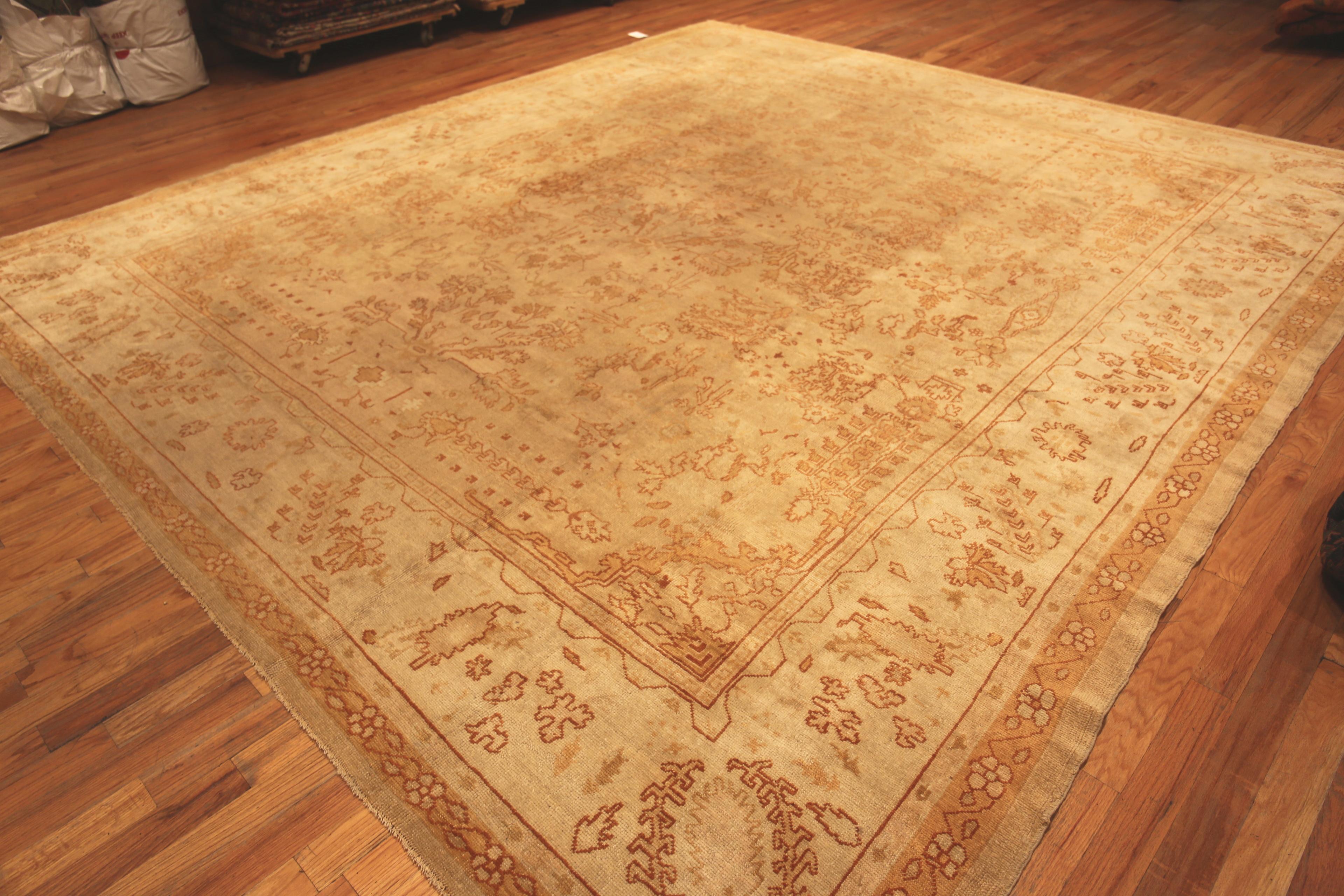 Antique Turkish Oushak Area Rug, Country of origin: Turkey, Circa date: 1900. Size: 12 ft 10 in x 14 ft 4 in (3.91 m x 4.37 m)
  