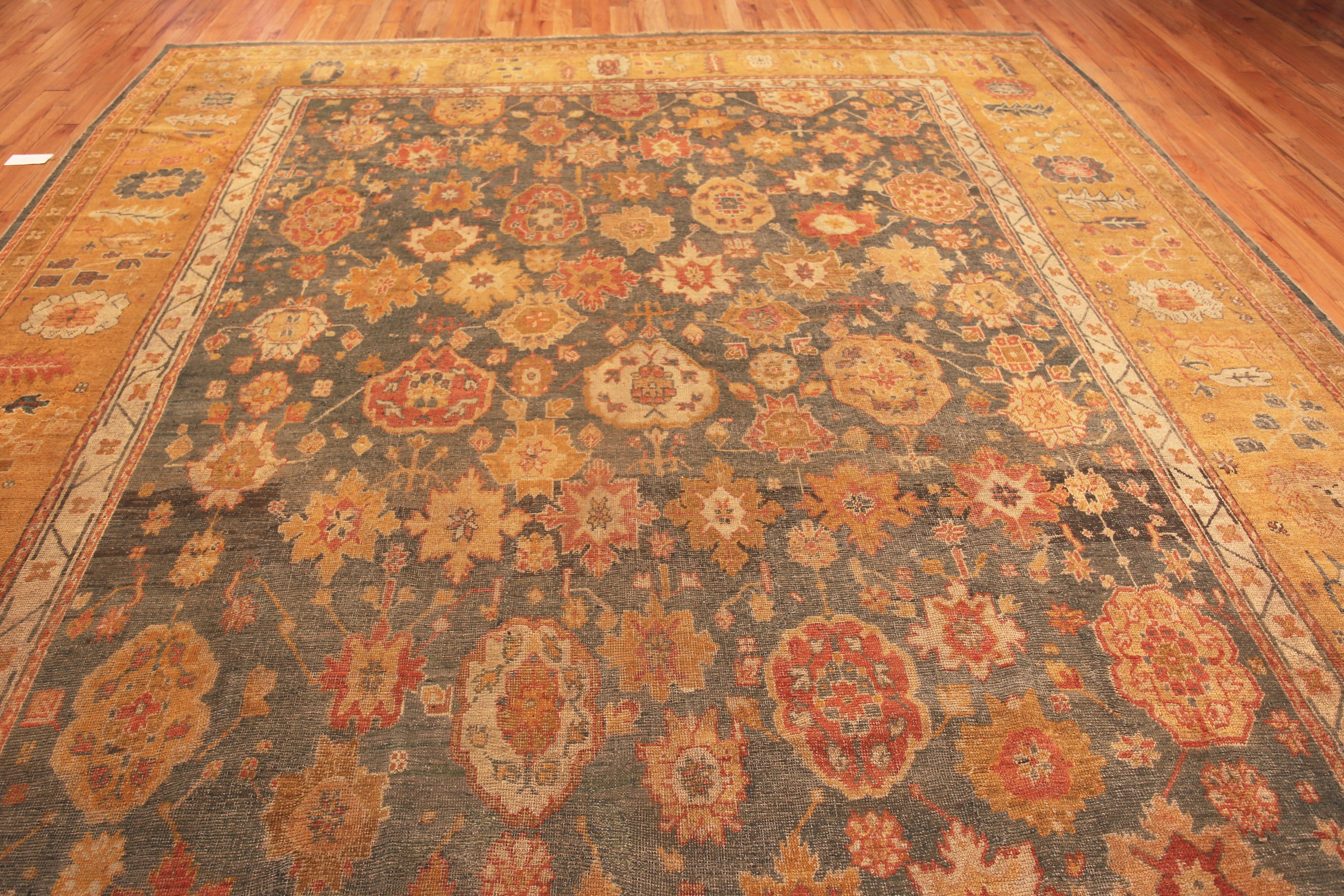 Warm Decorative Large Rustic Antique Tribal Abrash Turkish Oushak Rug, Country of Origin: Turkey, Circa date: 1900. Size: 12 ft 6 in x 15 ft 2 in (3.81 m x 4.62 m)