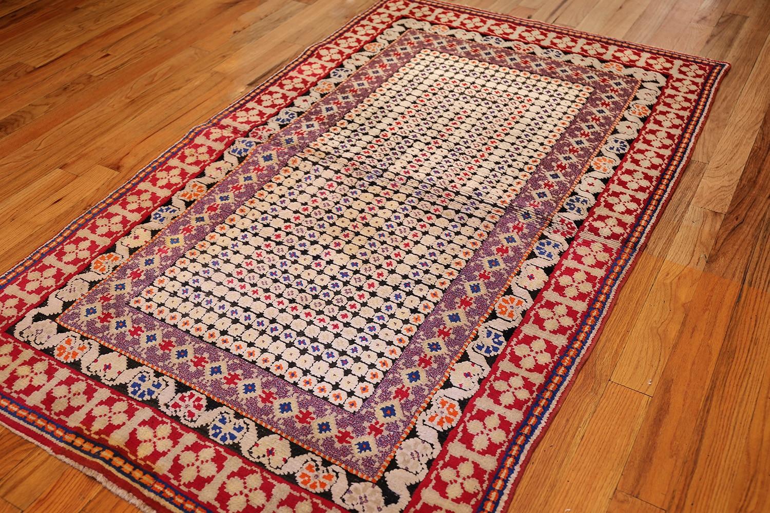 Antique Ukrainian rug, Ukraine, circa turn of the 20th century. Size: 4 ft. x 6 ft. 9 in (1.22 m x 2.06 m)

This fetching antique Ukrainian rug features a slightly eccentric composition, which, while not completely unorthodox in its presentation, is