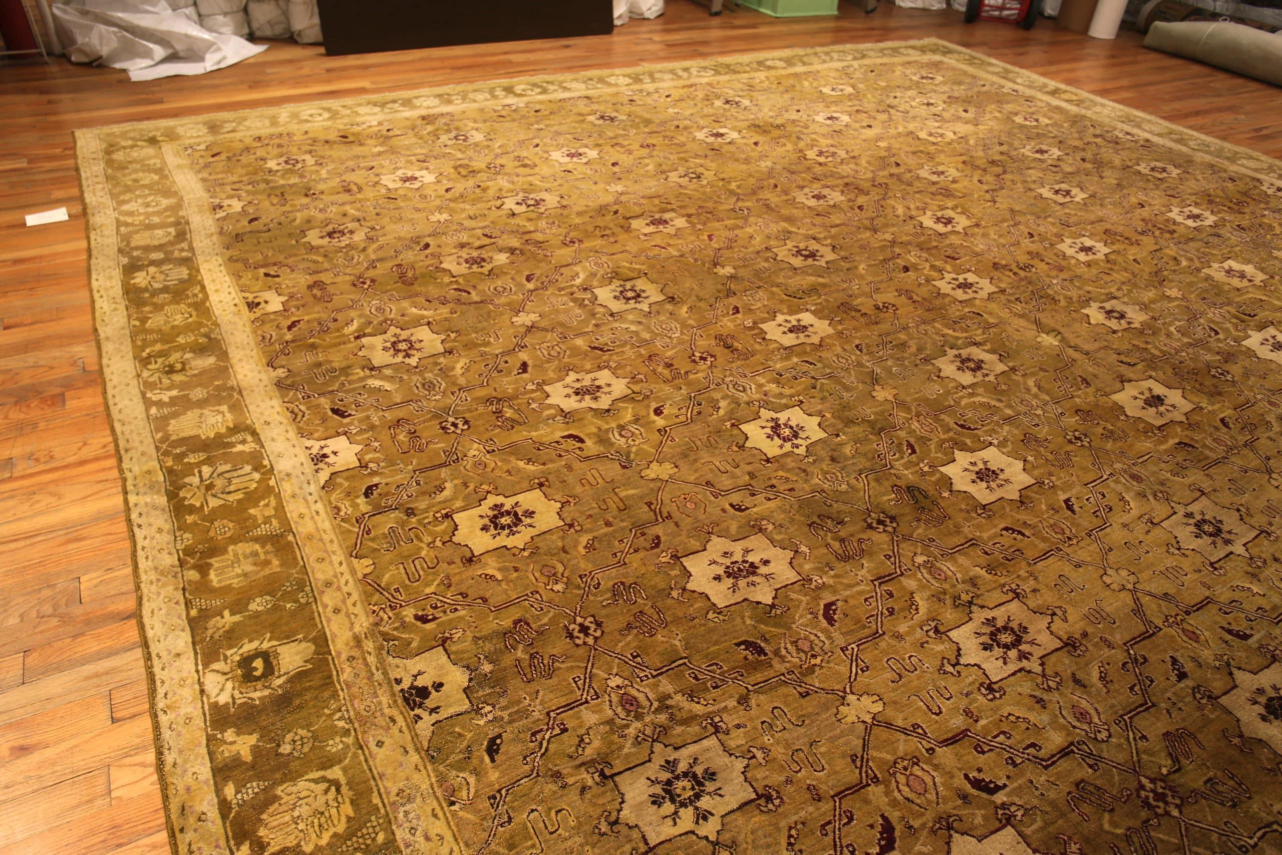 Beautiful Large Antique Indian Agra Rug, Country of Origin: India, Circa Date: 1880 – The gorgeous brown tones of this earthy, Agra rug from the 1880s are an excellent piece to add charm to any space that is large enough to accommodate it. Agra rugs
