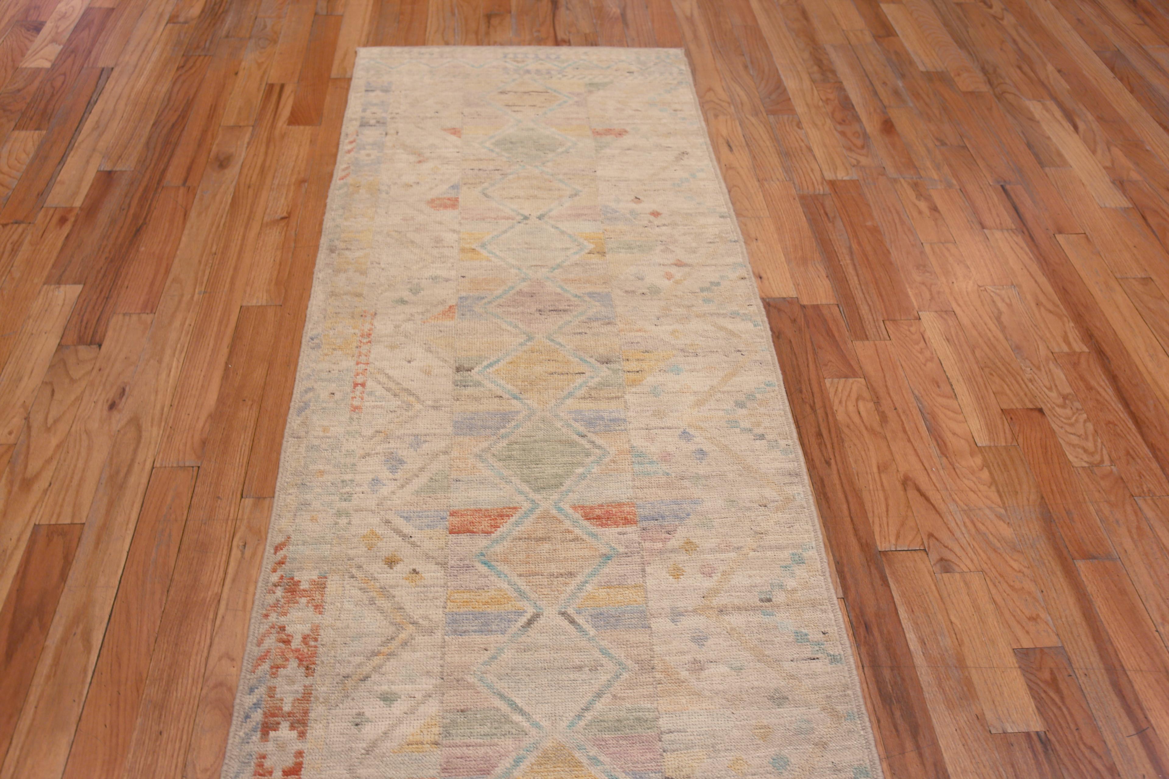 A Beautifully Artistic Decorative Light Ivory Cream And Pastel Color Tribal Geometric Design Modern Contemporary Hallway Runner Rug, Country of Origin: Central Asia, Circa Date: Modern Rug 