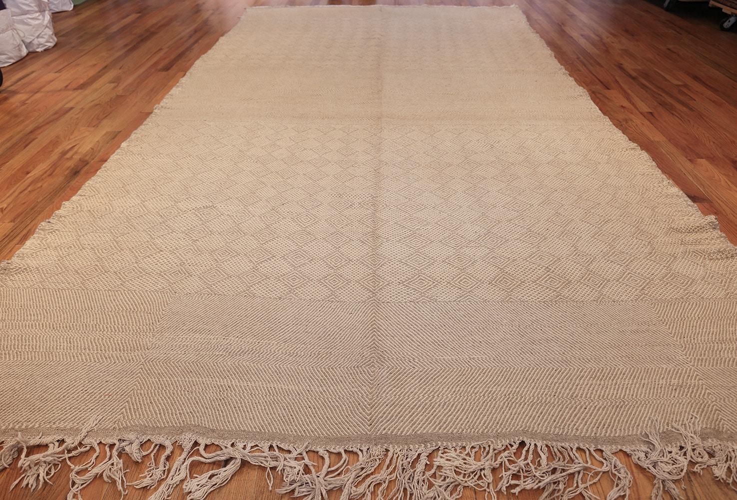 Vintage Moroccan rug, Origin: Morocco, circa mid-20th century – Size: 8 ft 3 in x 16 ft 4 in (2.51 m x 4.98 m)

Rendered in a charming selection of neutrals, this elegant vintage rug from Morocco depicts a variety of repeating motifs, including