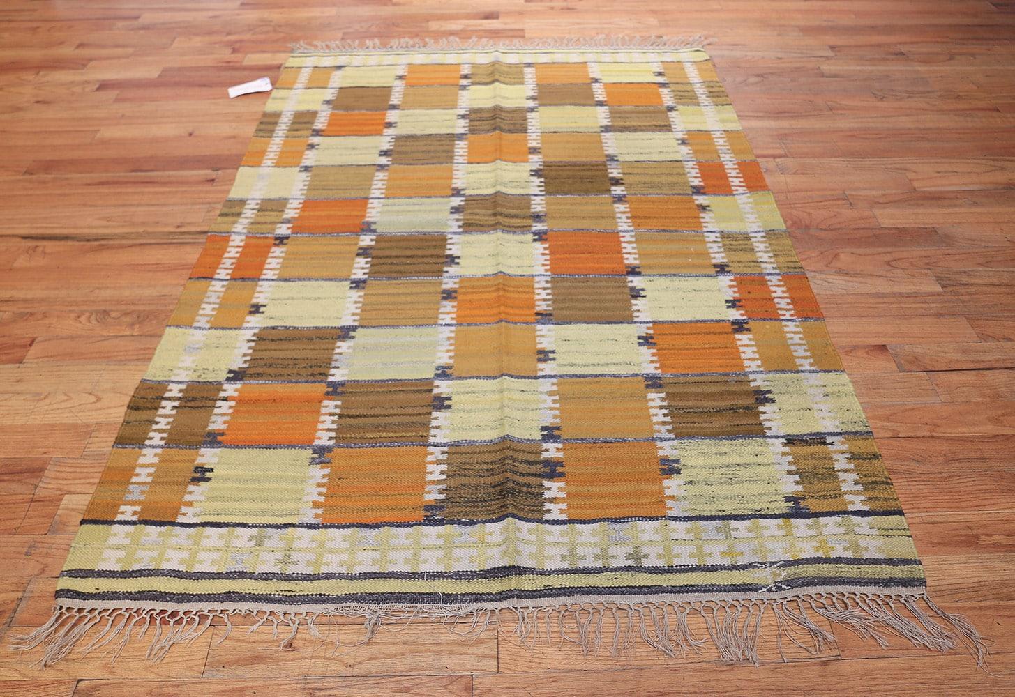 Vintage Scandinavian rug by Wanda Krakow, Origin: Sweden, circa mid-20th century. Size: 4 ft 8 in x 6 ft 8 in (1.42 m x 2.03 m)

This wonderfully modern midcentury vintage rug features a stark, well-defined pattern of repeating tiles that are