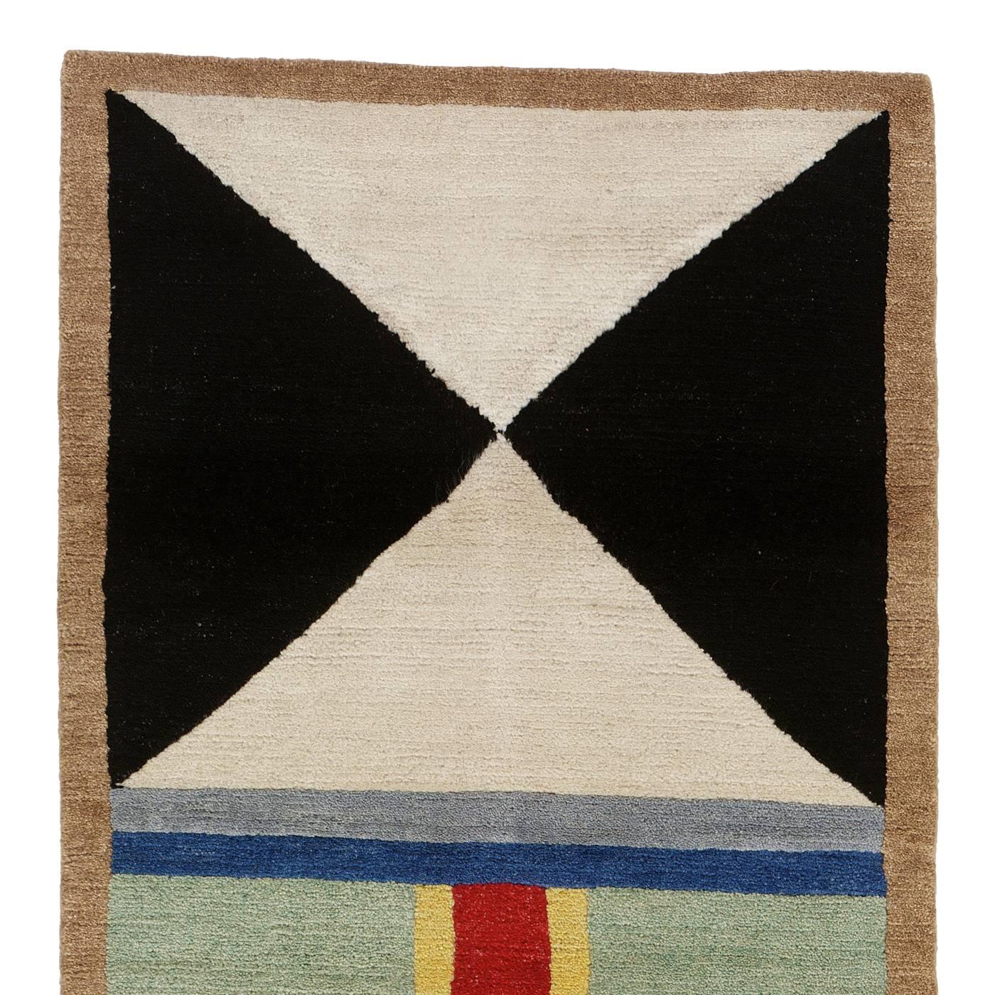 Striking and modern, this exquisite carpet will add color and a bold series of decorative patterns to enhance the look of any contemporary home. This piece is part of a limited series of 36, signed by designer Nathalie Du Pasquier and hand made by