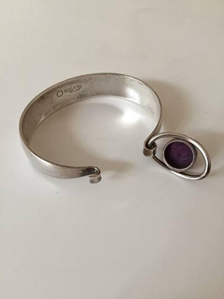 N.E. From Bracelet in Sterling Silver with Amethyst. Measures 6 cm / 2 23/64 in dia. in good condition, but stone has wear, but no chips. Weighs 32.6 g / 1.15 oz.