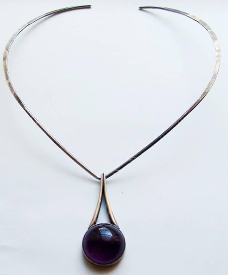 N.E. From/David Andersen Sterling Silver Necklace and pendent with Amethyst. Measures 5.3 cm / 2 3/64 in. Necklace and pendent is in good condition. Weighs 27 g / 0.95 oz