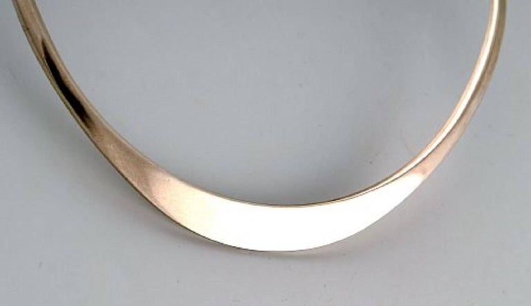 N.E. From necklace of sterling silver. Danish design 1970s.
Neckring diameter 13.5 to 14.5 cm.
In perfect condition.
Marked.
