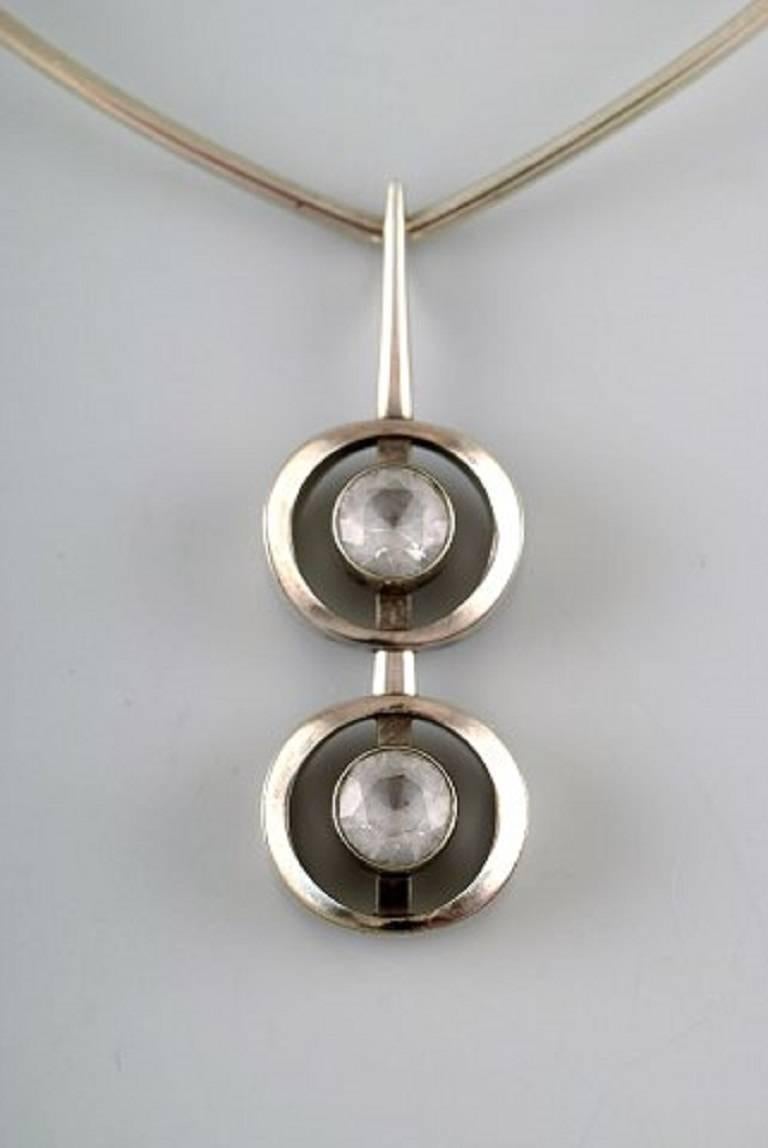 N.E. From sterling silver necklace, pendant with two mountain crystals. Danish design 1970s.
Neck ring interior 13.5 to 14.5 cm. Length pendant 6.5 cm.
In perfect condition.
Stamped.