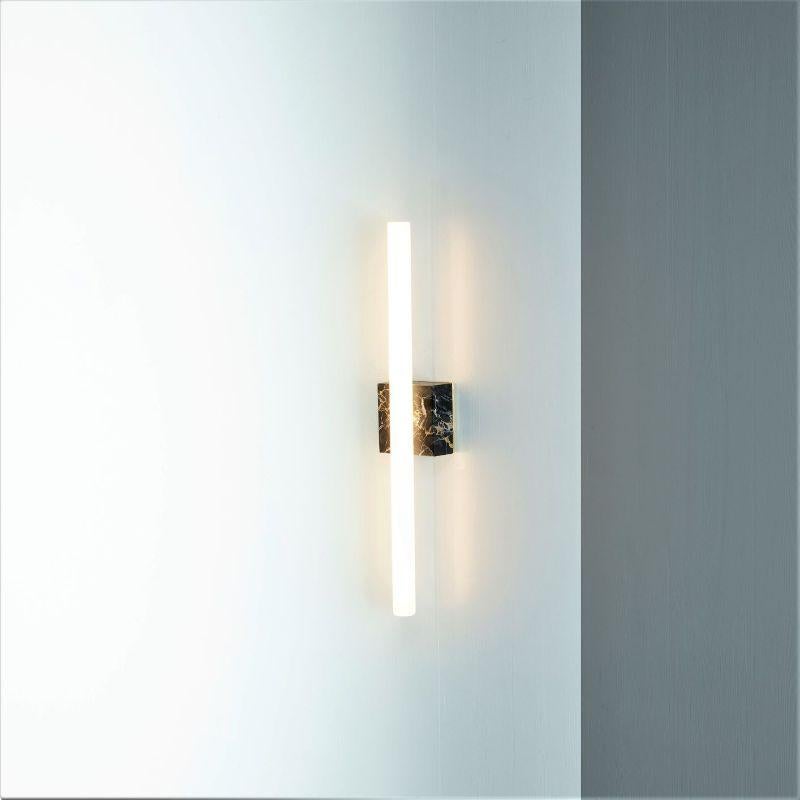 NEA Wall 50 Marble by Kaia
Dimensions: 9 x 7 x 50 cm
Lamps 3 x linear opal LED S14d*, 3 x 7 W, 2700 K
Mains ( Phase) dimmable, opal 250 lm
Materials: Black Marble, Brushed, Oiled and Waxed Brass

Also Available: Different colors marbles,