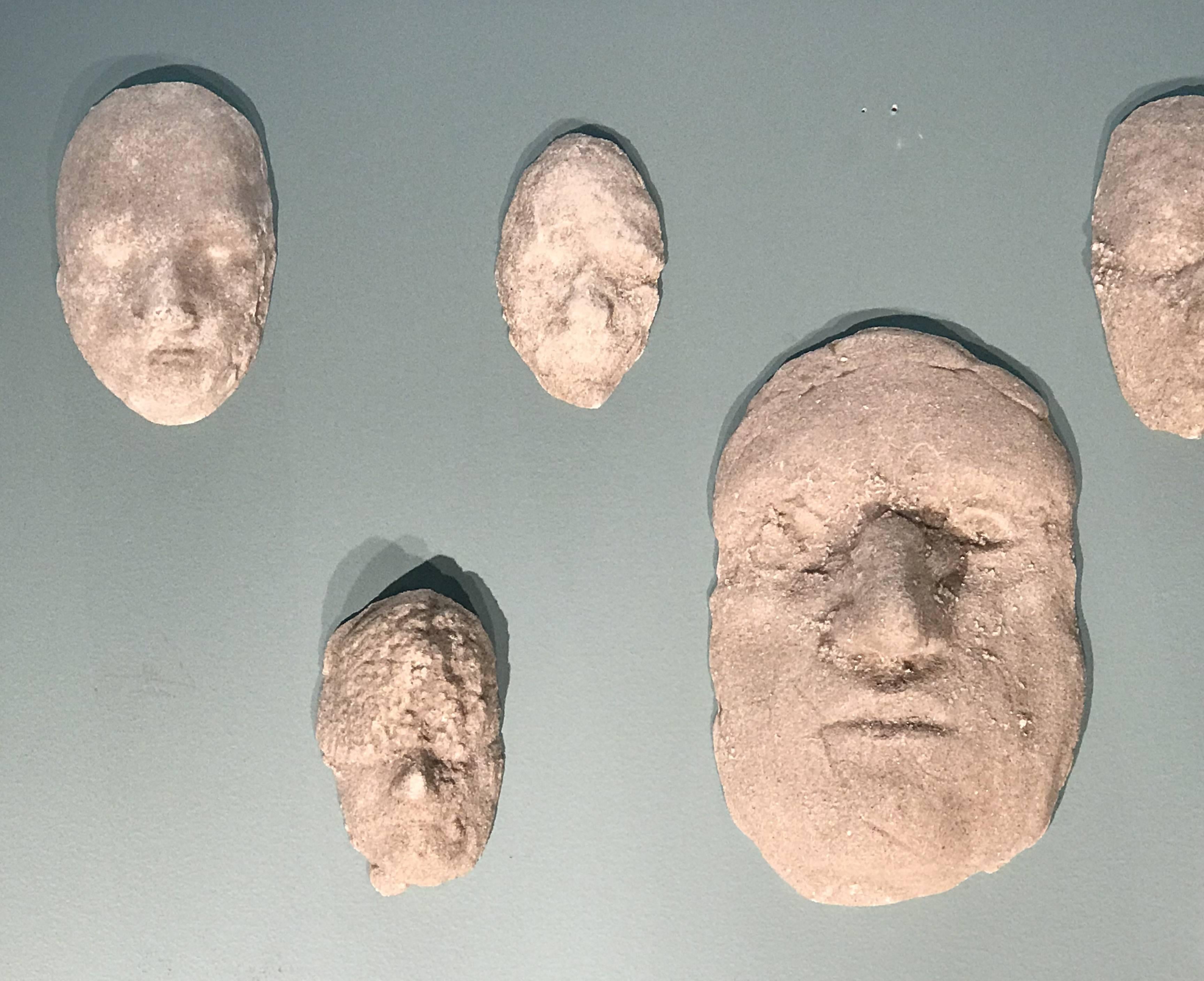 A fine set of 12 plaster relief sculptures titled “Heads” by American sculptor and artist Neal Beckerman (20th / 21st century). Beckerman was born in 1949 in Newton, Massachusetts. He attended the School of the Museum of Fine Arts, Boston,
