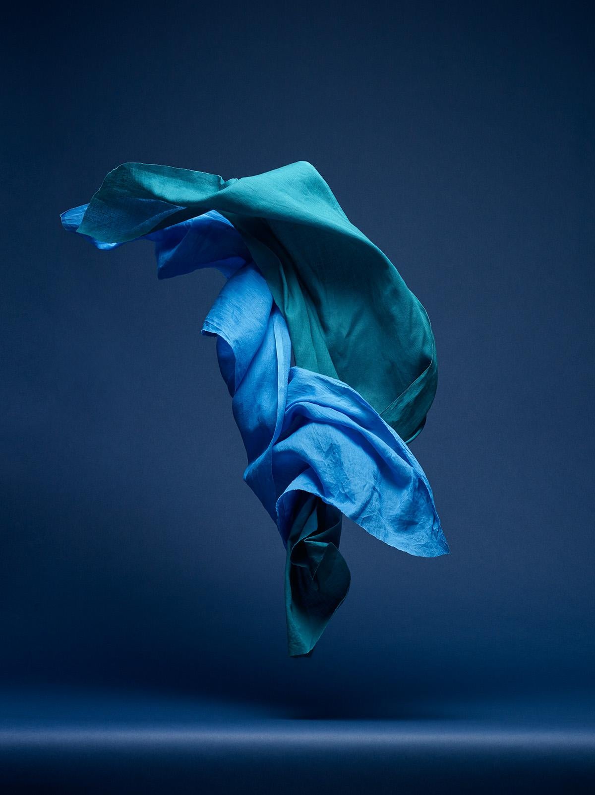 Neal Grundy Color Photograph - Dancing Fabric, Light Blue and Green 2