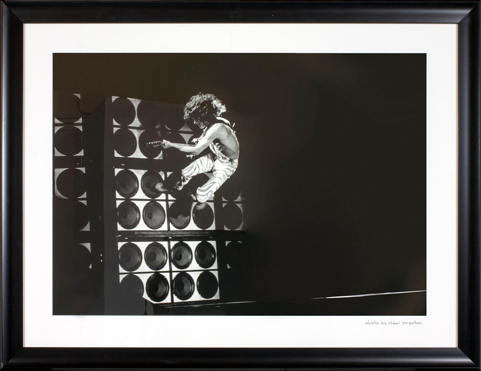 "Eddie Van Halen Wall Jump" photograph by Neal Preston. Photo by Neal Preston hand written on front lower right corner. This framed photograph was previously displayed in a guest rooms of the original Hard Rock Hotel & Casino in Las Vegas, Nevada,