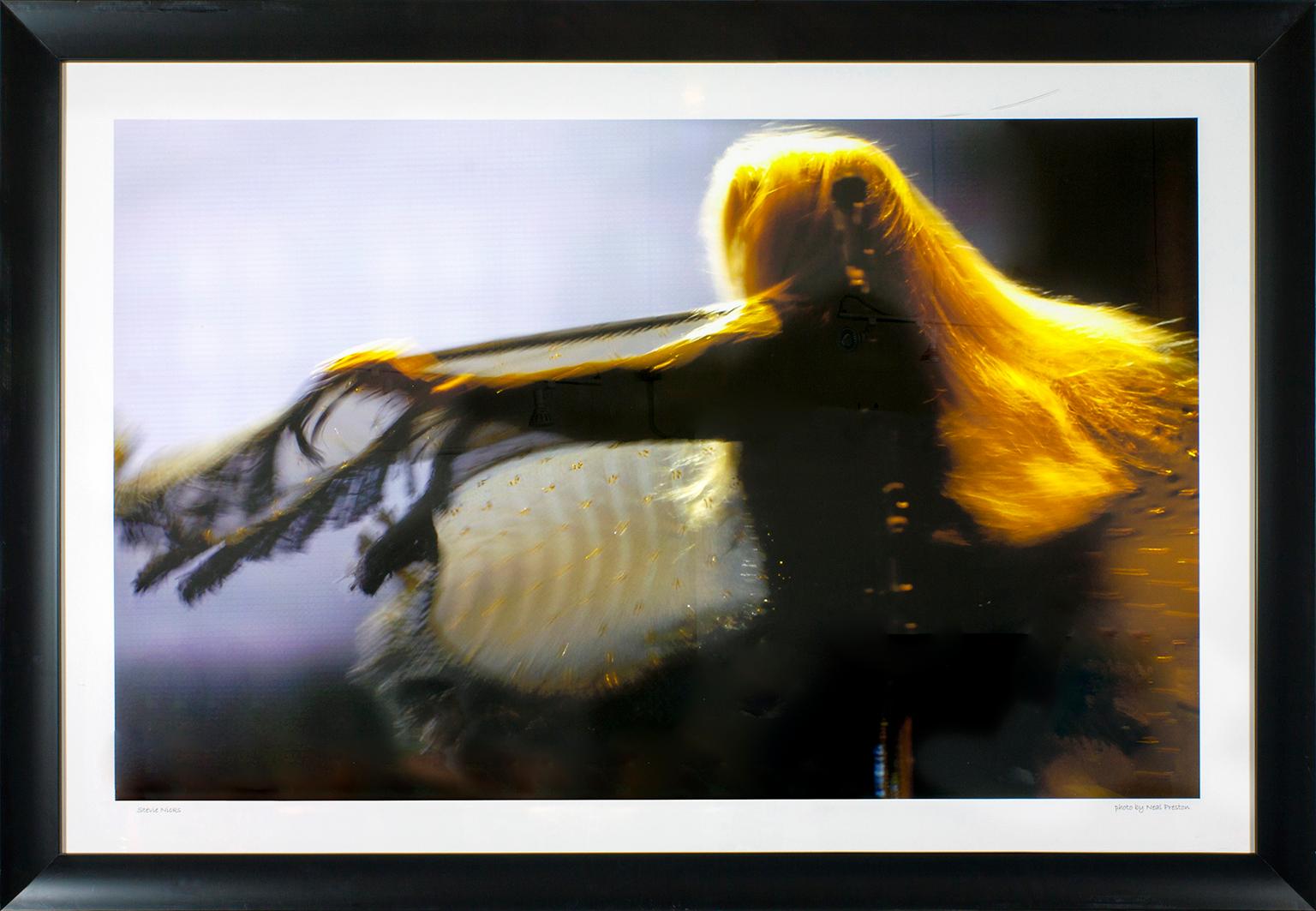 "Stevie Nicks" framed photograph by Neal Preston. Image size: 33 1/4 x 53 1/4. "Stevie Nicks" hand written in front lower left corner. "Photo by Neal Preston" hand written in front lower right corner. This photo was previously displayed in a guest