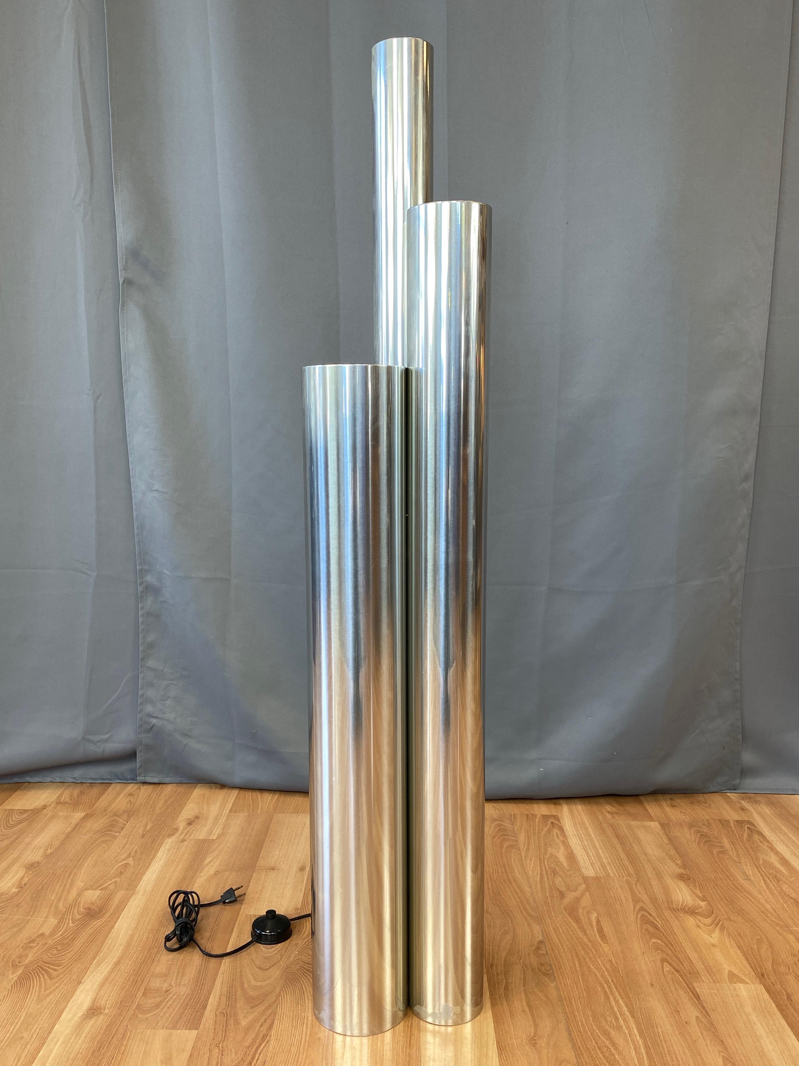 A fantastic 1970s tubular polished aluminum floor lamp by Neal Small for Koch & Lowy.

Frequently misidentified as a Skyscraper lamp by Vladimir Kagan, this impressive architecturally sculptural piece is actually by Mid-Century Modernist master of