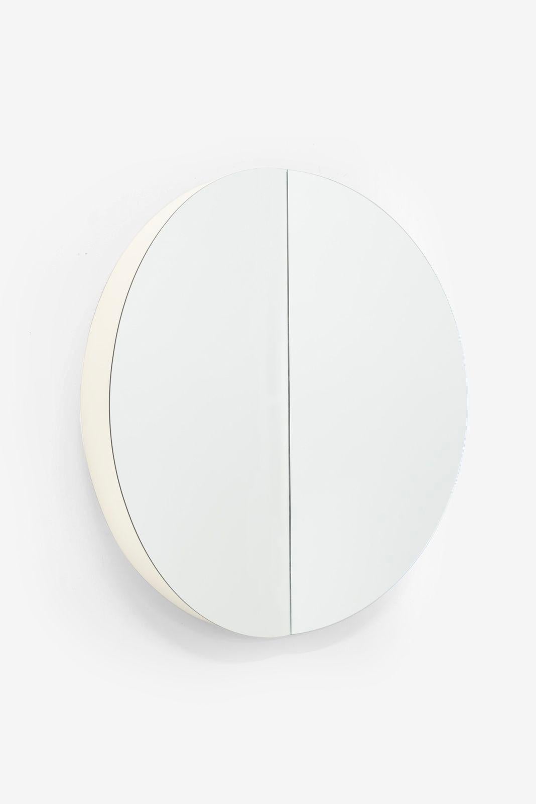 Neal Small Round Split Wall Mirror can be displayed vertically or horizontally, with 2 cleated supports on the backside.
White lacquered 6