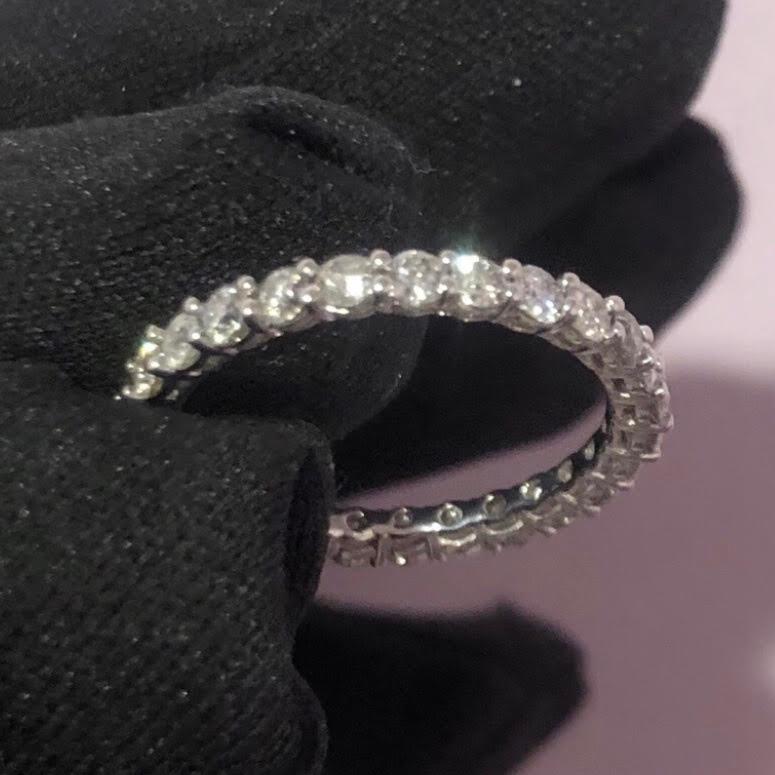 Classic near 2 Carat round diamond full eternity band ring in 14k white gold. 27 round brilliant diamonds (SI-I clarity) are hand set in this full eternity band weighing near 2 Carats.  


This eternity diamond band sparkles beautifully in the