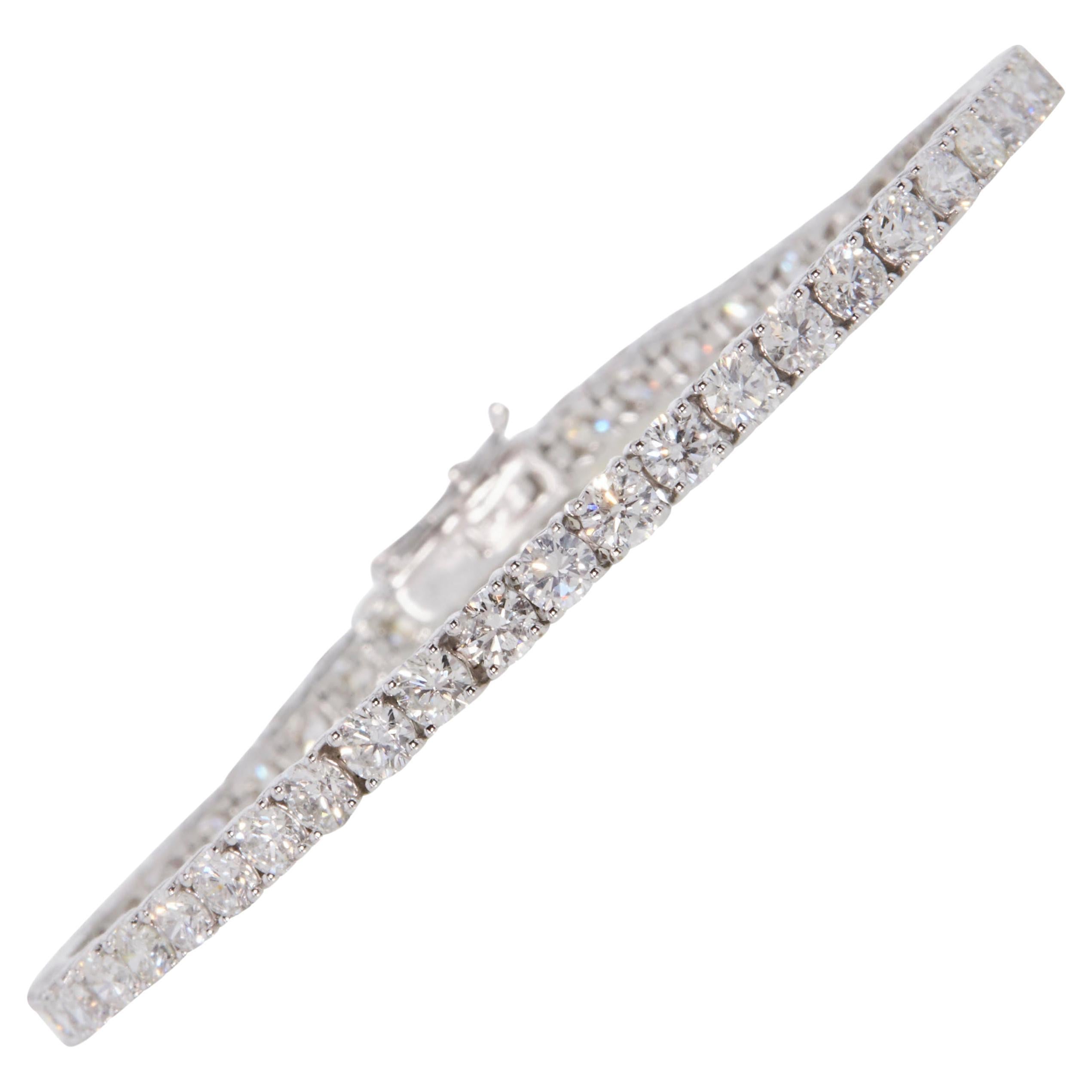 Classic Near 5 1/2 carat round natural diamond tennis link bracelet in 14k white gold. 63 round brilliant natural diamonds (SI-I clarity, natural earth-mined) are hand set in this diamond tennis bracelet weighing near 5 1/2 carats.


This near 5 1/2