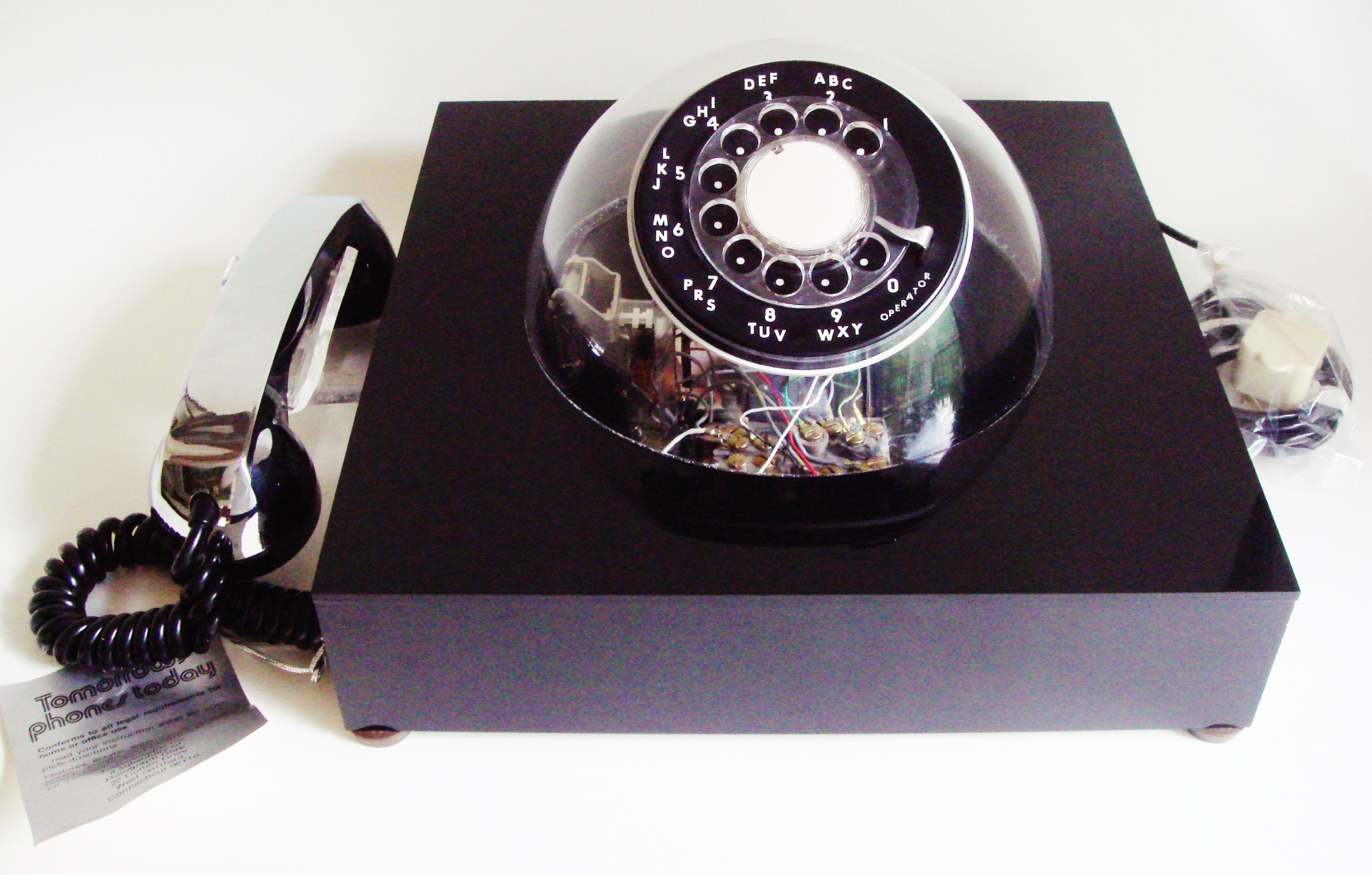 This scarce and near mint black, chrome plate, clear plastic, rotary dial Teledome (model # 300) desk phone was patented in 1972 and is one of the most sophisticated models in the wonderfully designed line-up of phones produced by the TeleConcepts