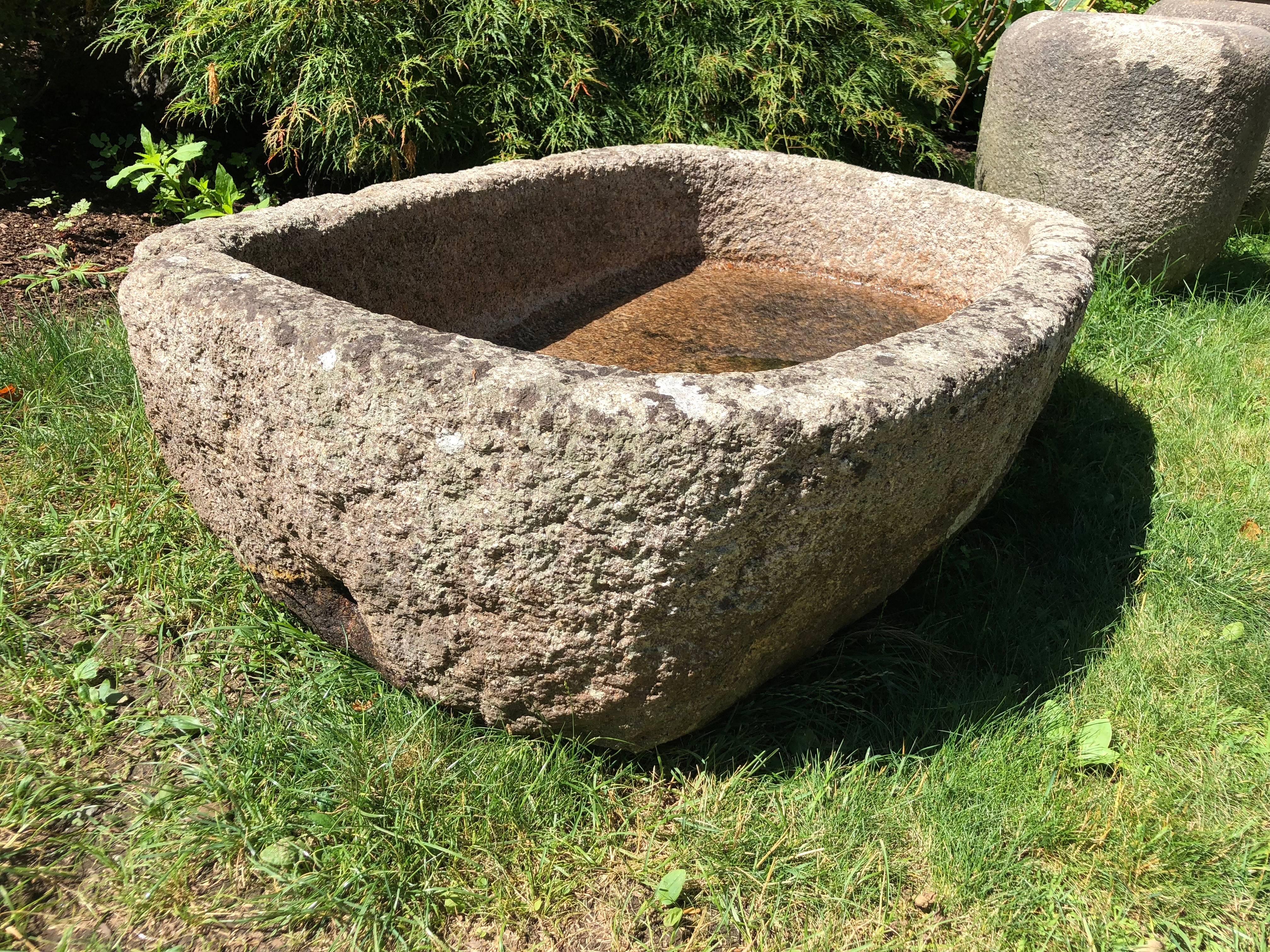 We so love granite from Cornwall and we were lucky enough to score two gorgeous troughs on our last buying trip. This one is the larger of the two and featured a nearly oval shape with beautifully-rounded corners and a heavily weathered surface