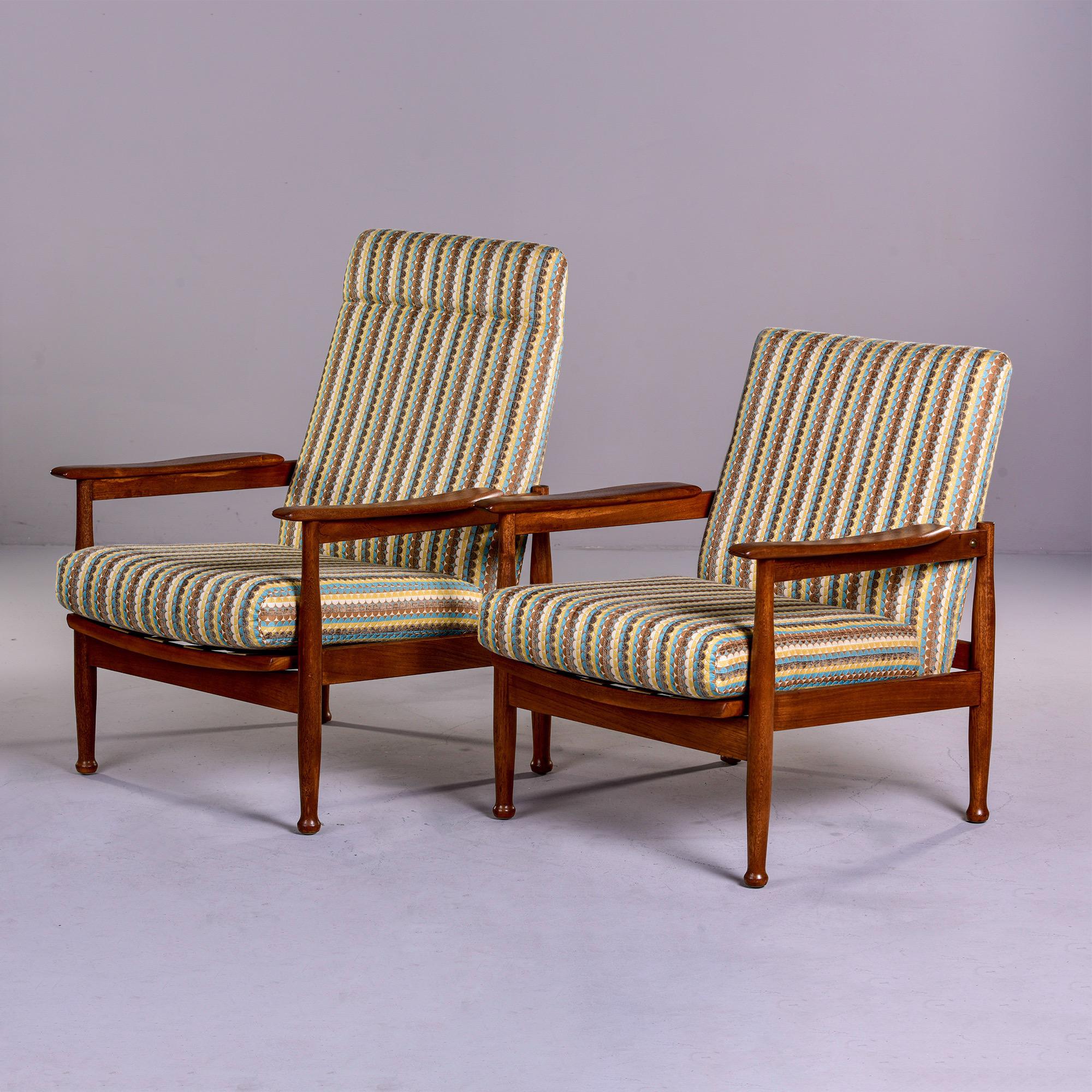 Near pair mid century Scandinavian Reclining elm chairs

This mid century near pair of Scandinavian elm wood framed reclining chairs date from 1970. Sometimes referred to as a King and Queen chair, these chairs are meant to be used together.