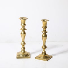Near Pair Neoclassical Balustrade Form Brass Candleholders with Square Bases