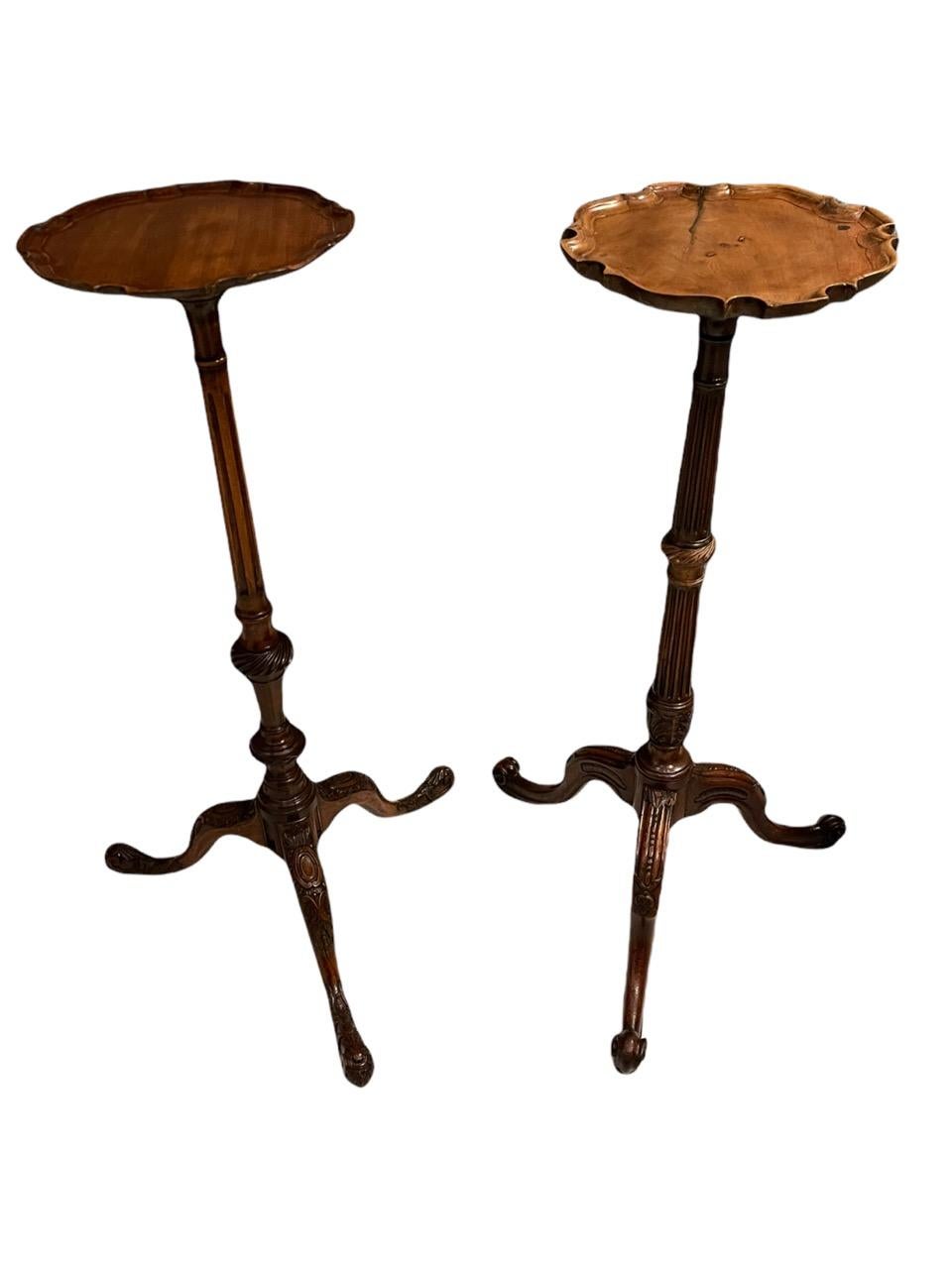 Near Pair of 19th century drink tables. Circular top with pie crust edge, stop-fluted columnar standard, tri-partite base, carved cabriole legs, and carved scrolling feet.
  