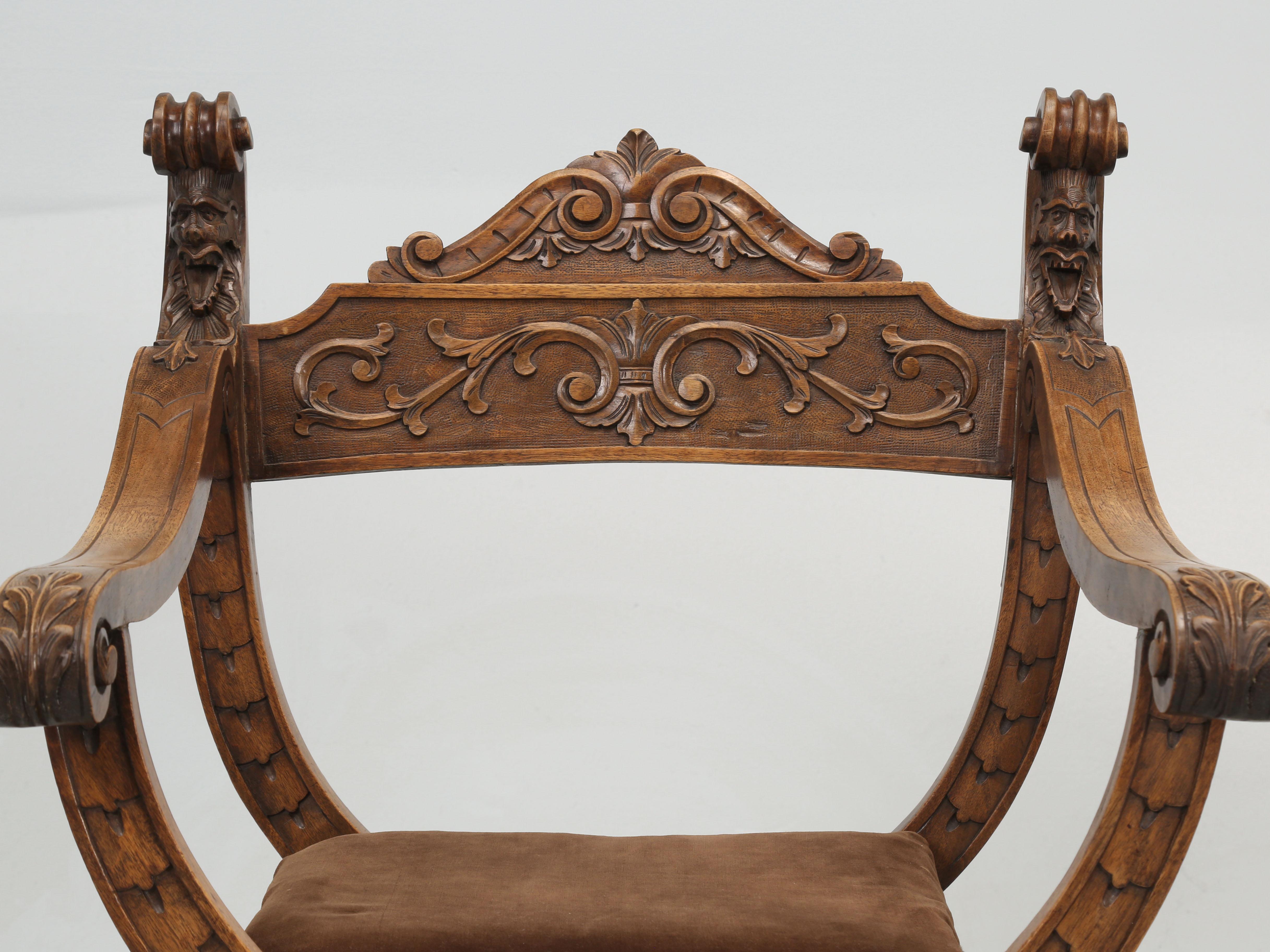 Antique French walnut armchairs, commonly referred to in the style of Dagobert. The infamous Dagobert chair is a traditional French armchair that originated with the legendary bronze throne chair of King Dagobert I, who reigned during the 7th