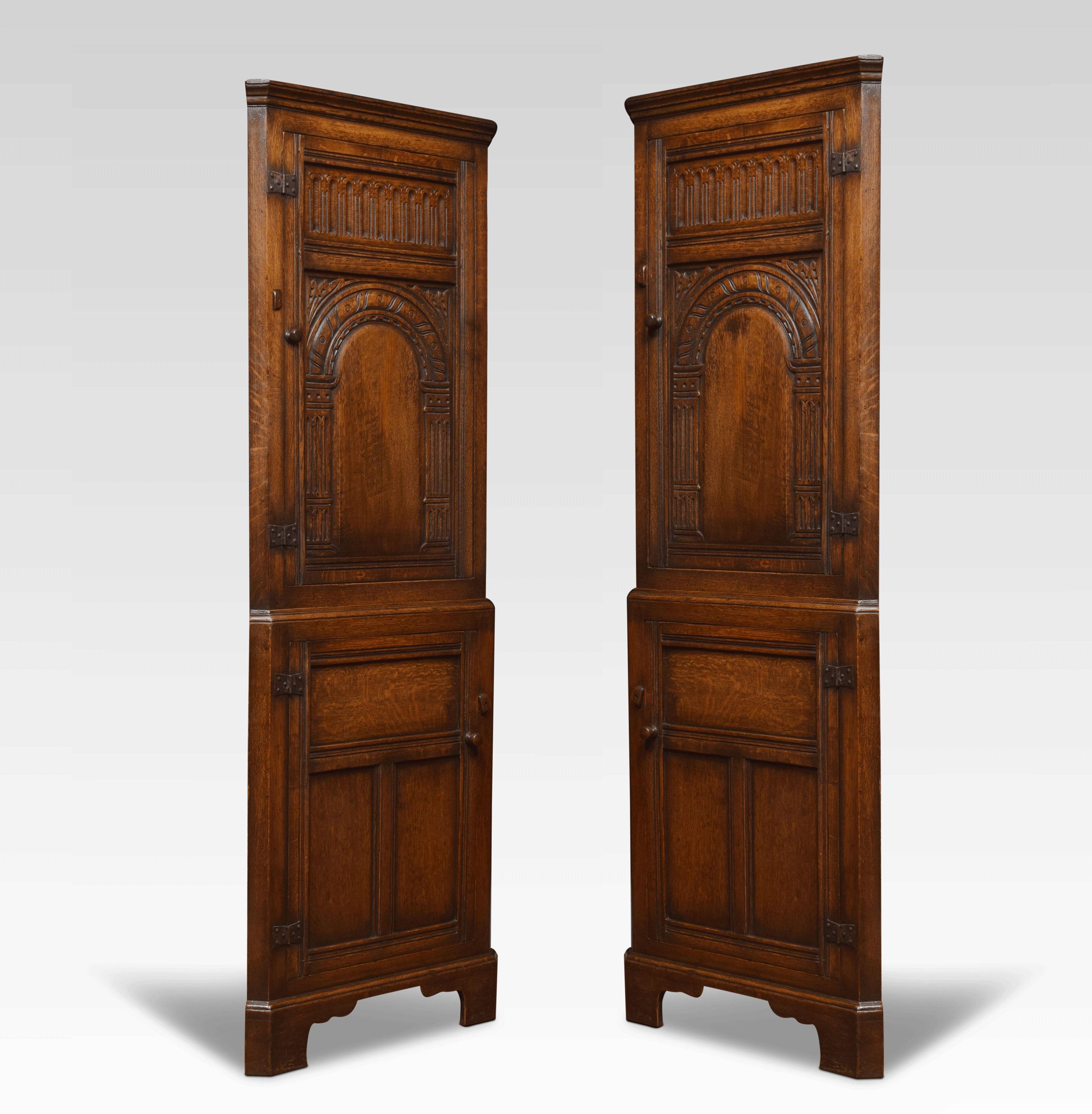 20th Century Near Pair of Carved Oak Corner Cupboard For Sale