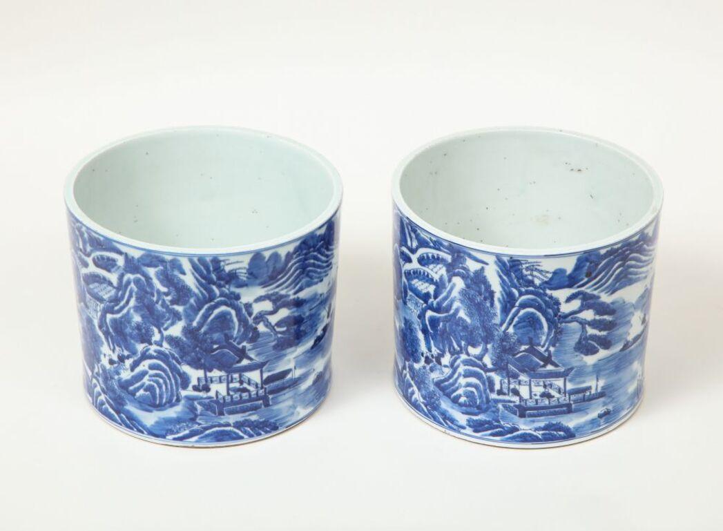 Densely painted in blue monochrome enamel with Chinoiserie scenes. Unmarked. Of substantial size and suitable as cachepots.