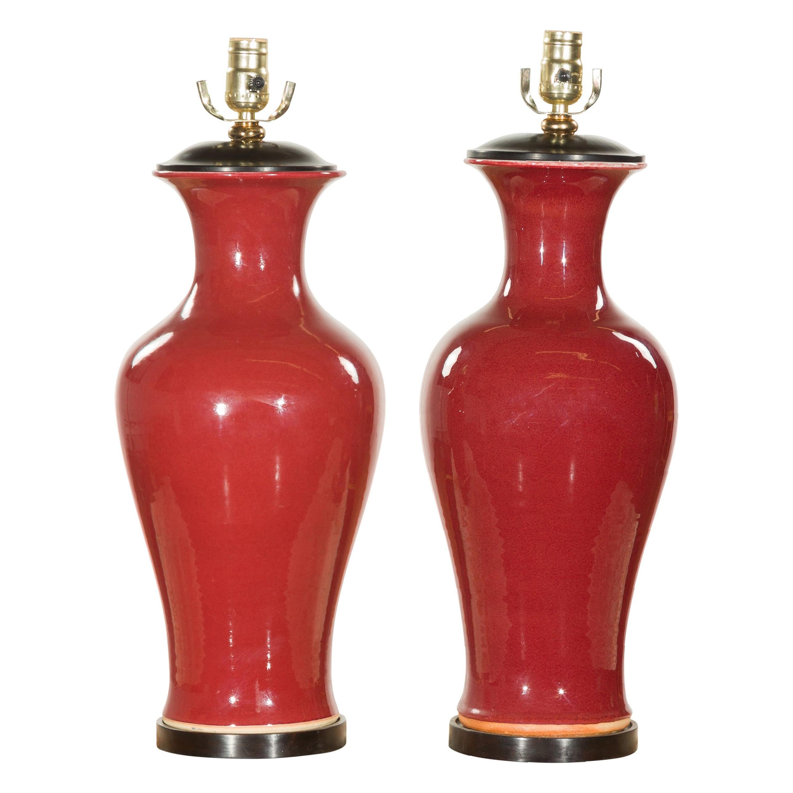 Near Pair of Chinese Contemporary Oxblood Vases Made into Table Lamps on Bases