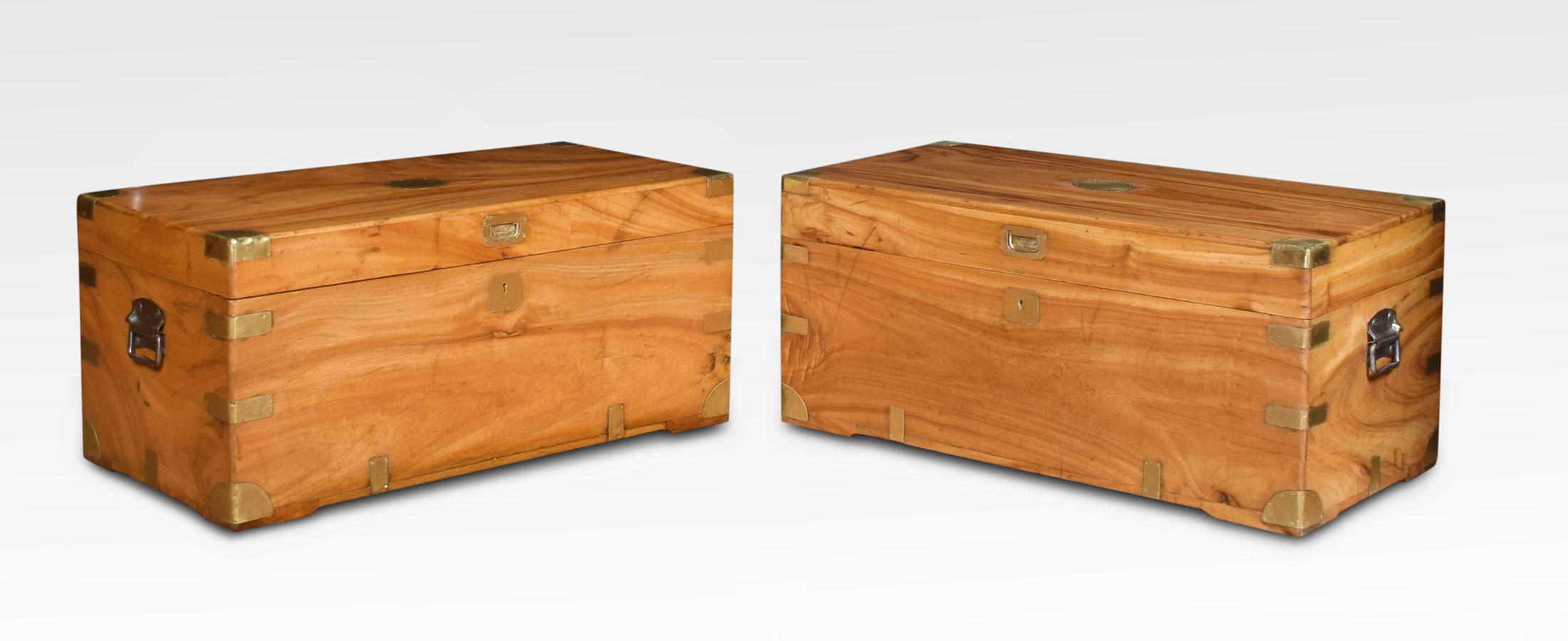 Near pair of Chinese export brass-bound camphorwood chest. The large rectangular hinged tops opening to reveal large storage area with brass straps and side-carrying handles.
Dimensions:
Height 16 inches
Width 35.5 inches
Depth 17 inches.