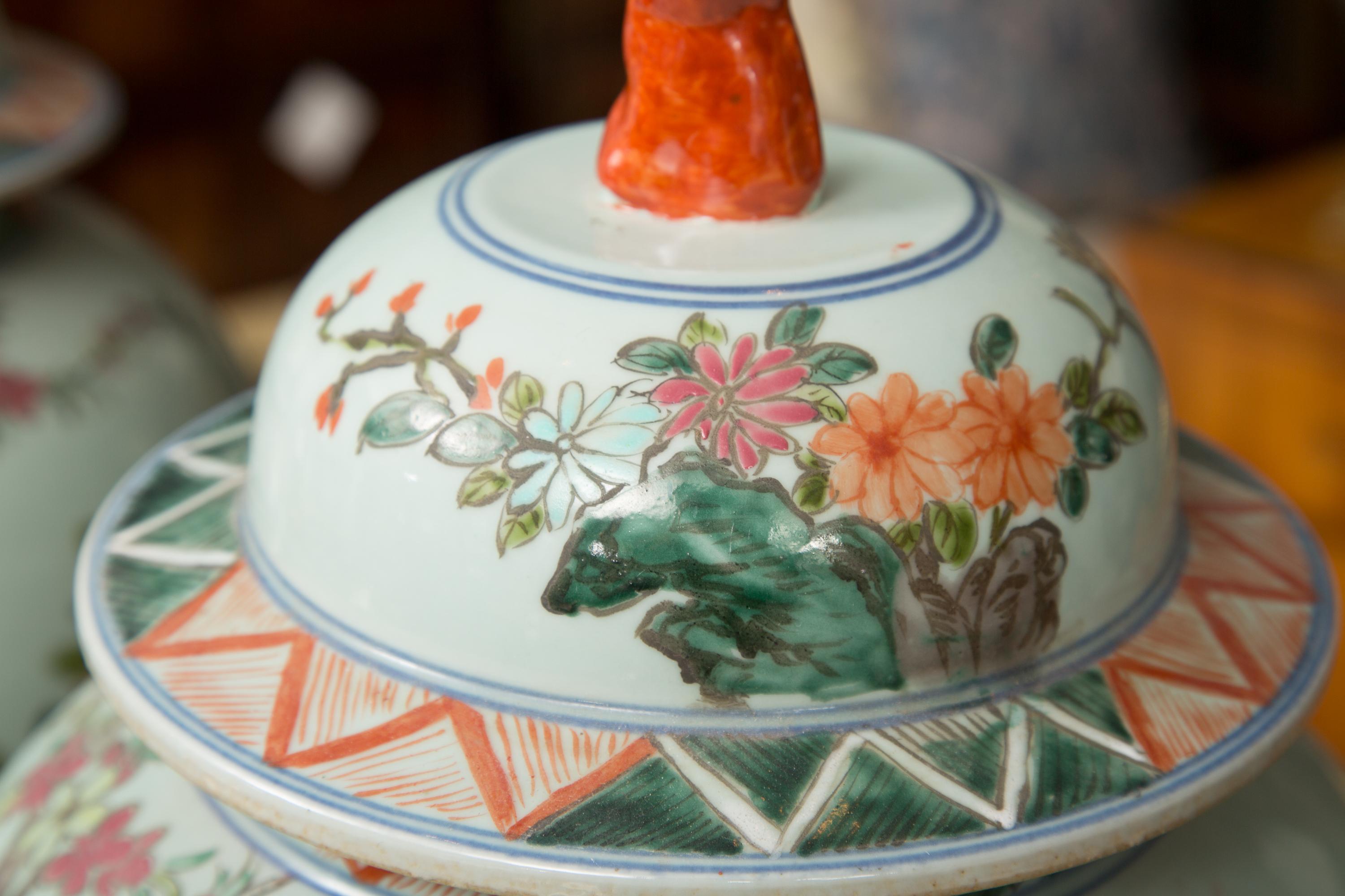 Hand-Painted Near Pair of Chinese Lidded Urns