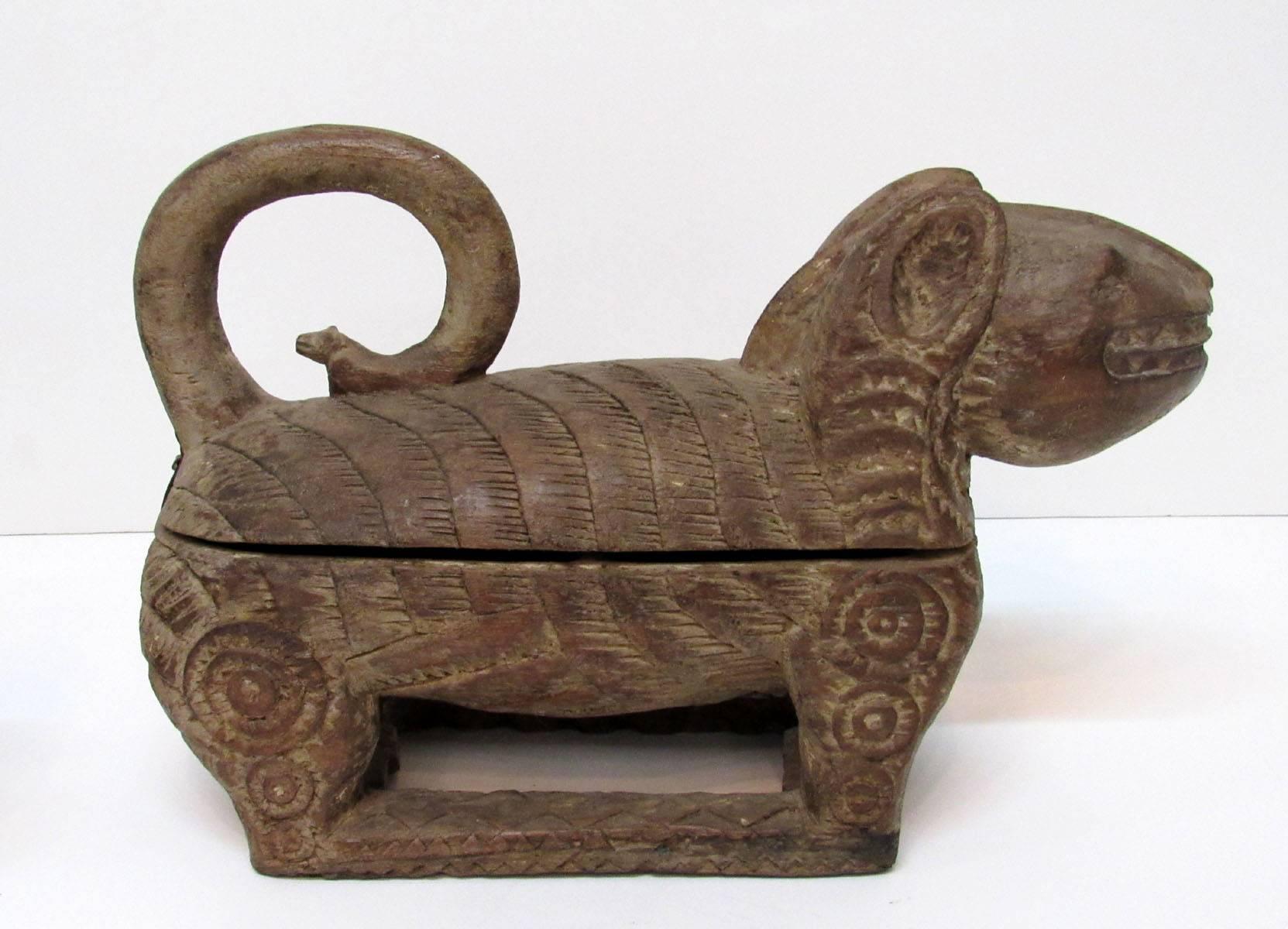 Near pair of early 19th century hand-carved wooden boxes in the shape of animals, most likely monkeys, purchased in Siam. One is larger than the other, the smaller is 11½