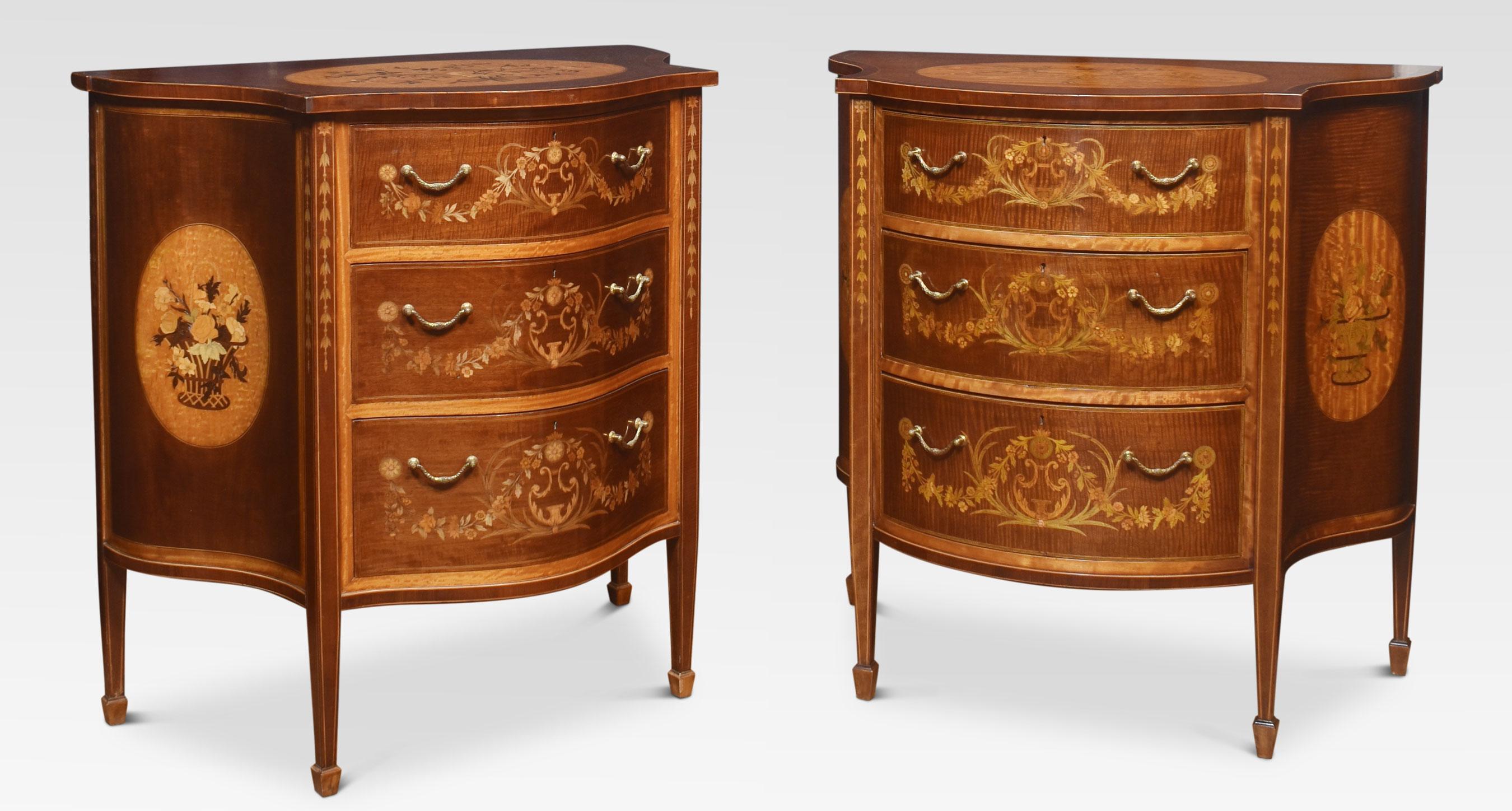 Near pair of Edwards and Roberts chest of drawers in the Hepplewhite taste. The shaped tops one with a seprentine outline the other bow fronted with satinwood inlaid oval panel, with a floral spray and ribbon tie within stringing and crossbanded