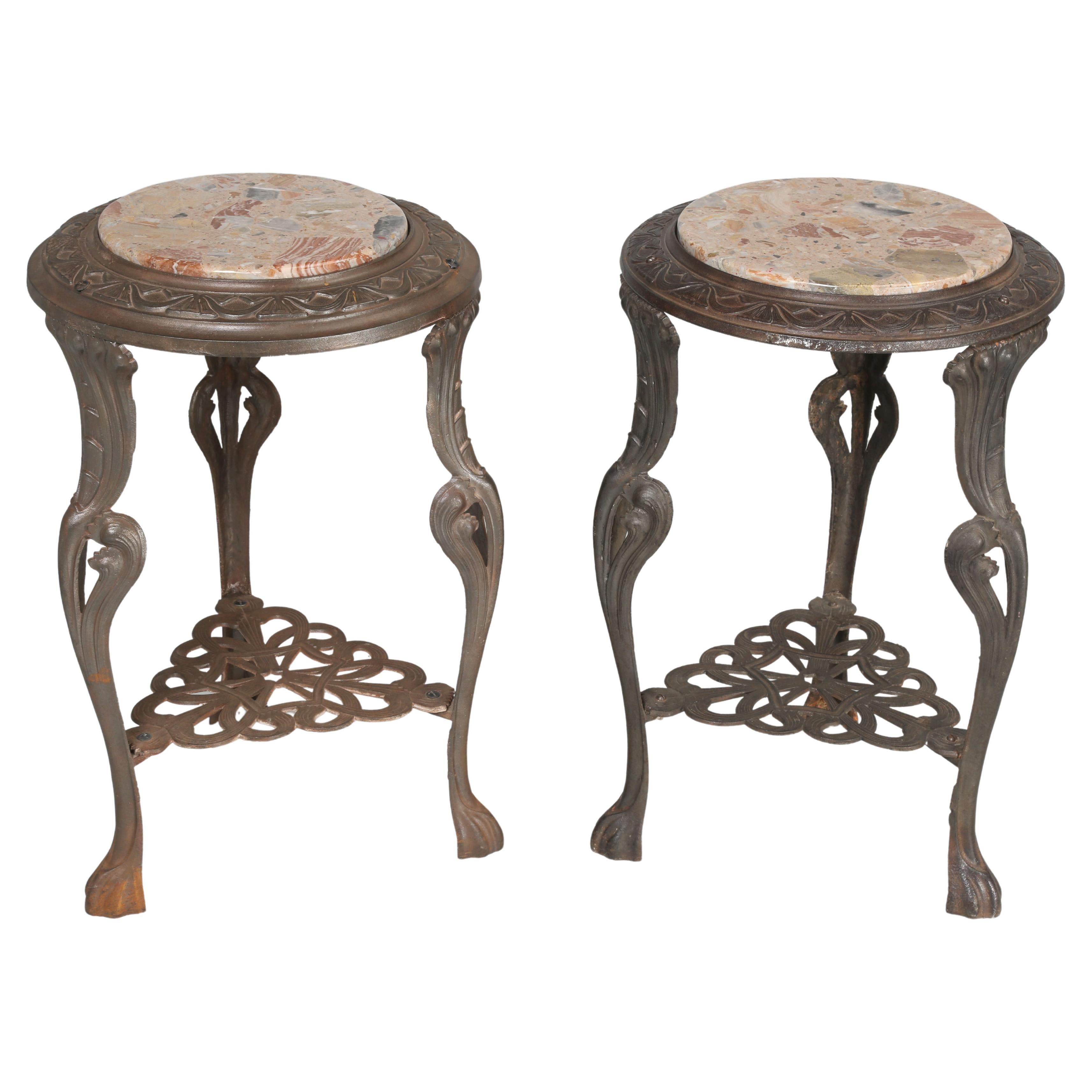 Near Pair of French Art Nouveau Guéridon Cast Iron Tables with Stone Tops (Paire de tables en fonte avec plateaux en pierre)