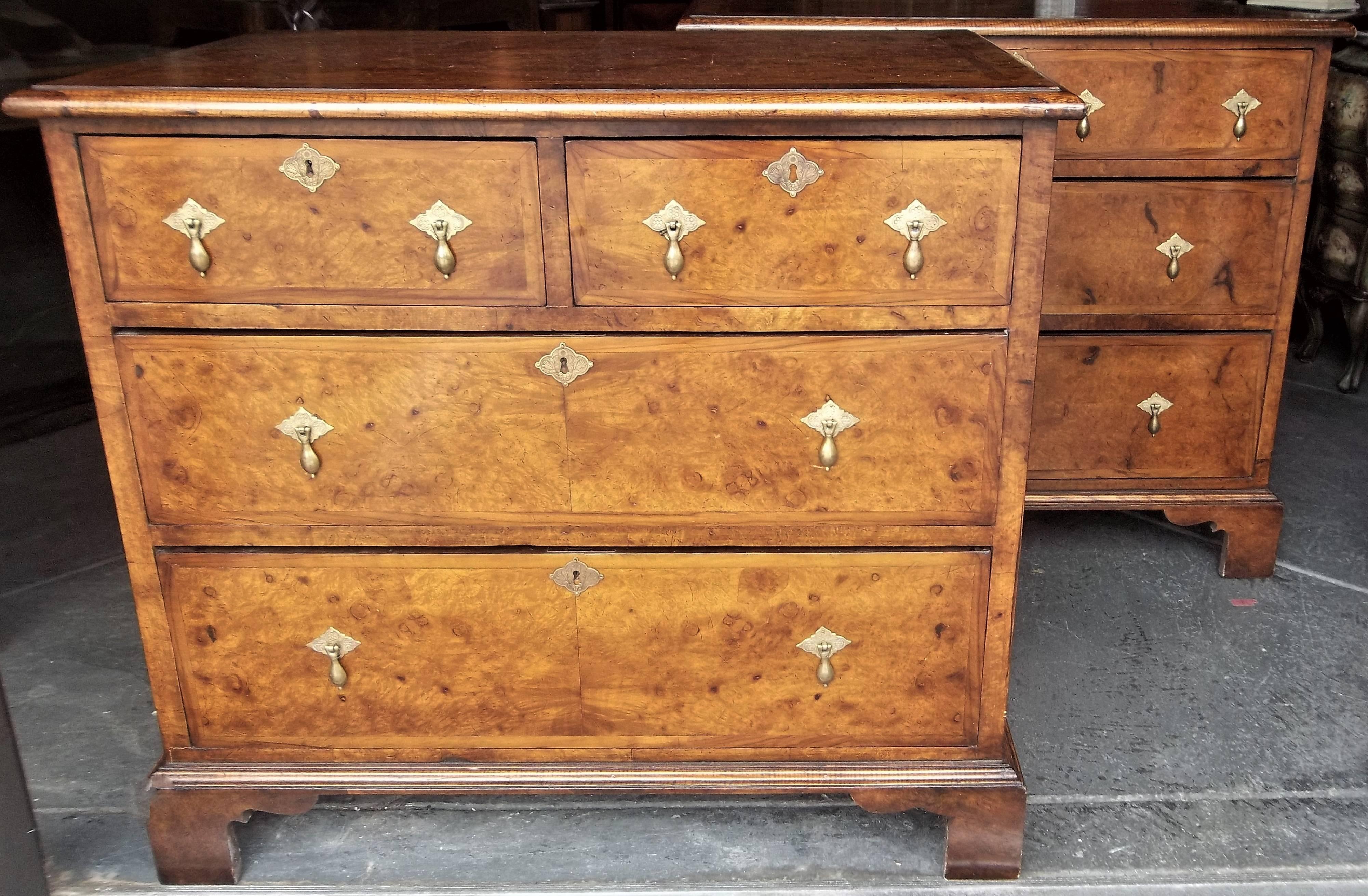 Made together in custom cabinetry shop, a near pair (one has two short drawers at top, the complimenting chest has one long drawer at top with inlay to give appearance of two short drawers). Exceptional veneers with swirls, knots and burl. The