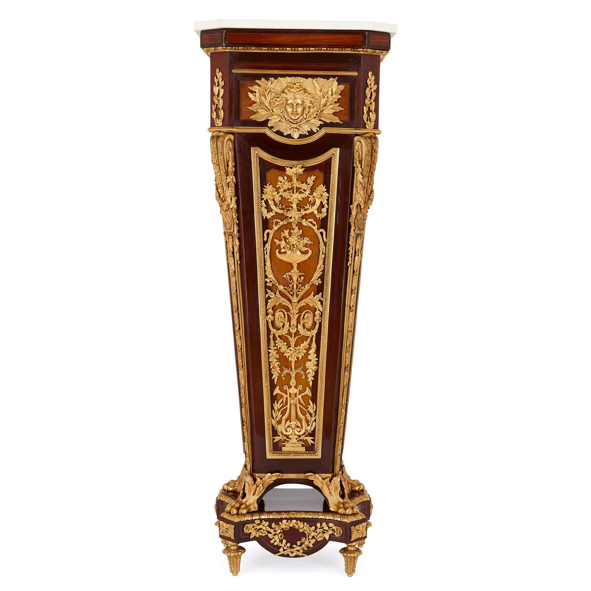These beautiful pedestals are based on a design by the acclaimed French craftsman, Jean-Henri Riesener (1734-1806). Riesener was the official cabinetmaker to King Louis XVI, and was a particular favourite of Marie-Antoinette. These pedestals are
