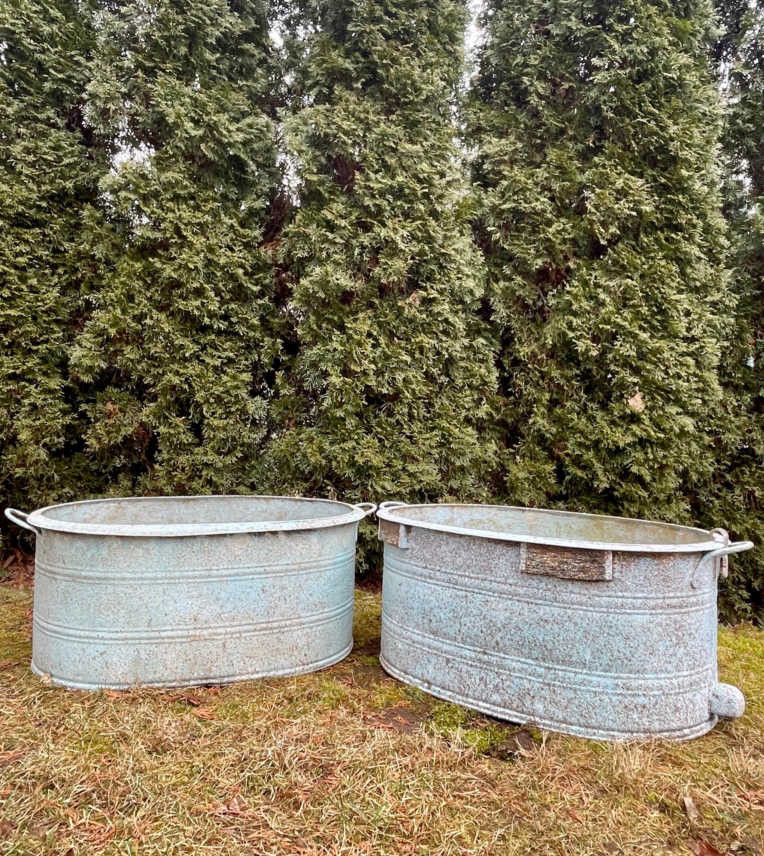 We were fortunate to source several near-pairs of these marvelous galvanized tub planters that date to the 1930s and had them custom-finished by a very talented artisan in Spain. This is the smallest set we have (the other 3 pairs are larger). The