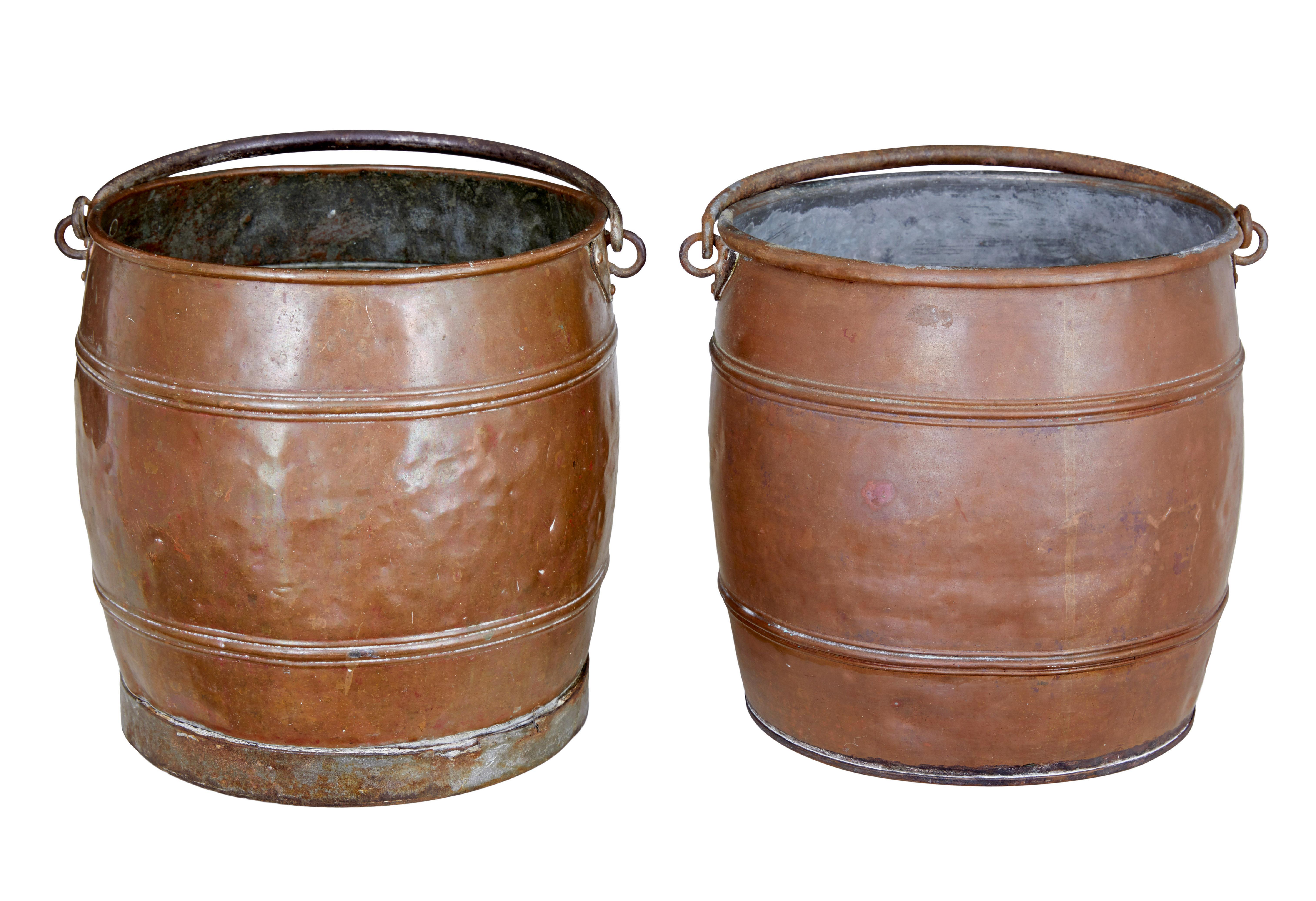 Pair of late 19th Century copper buckets circa 1890.

Near pair of copper pails.  Ribbed detailing with steel handles.  1 pail which has corroded through the bottom and is only suitable for display purposes.

Ideal for fireside kindling or coal